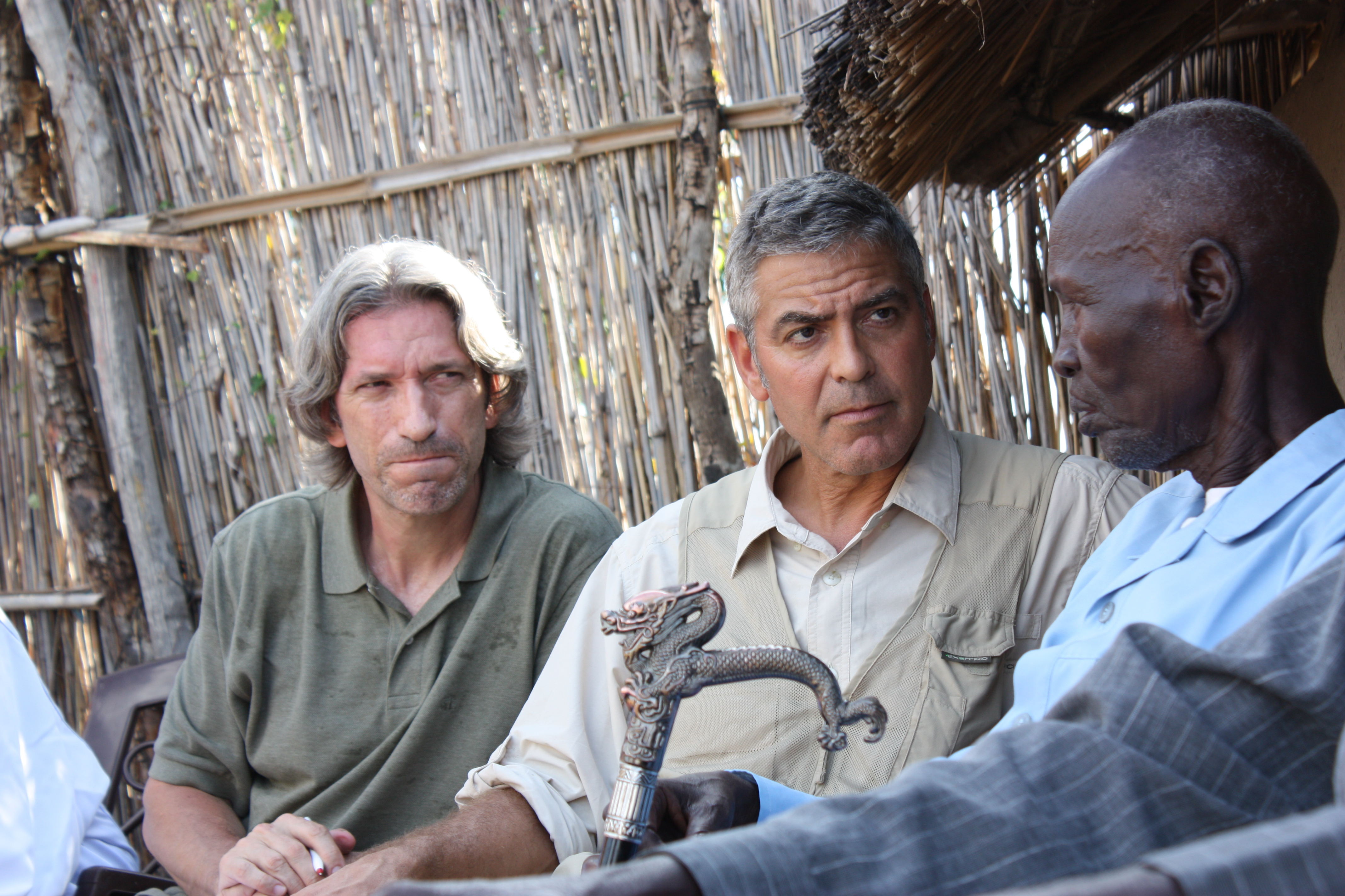 Prendergast, left, and Clooney meet with Sudanese elders