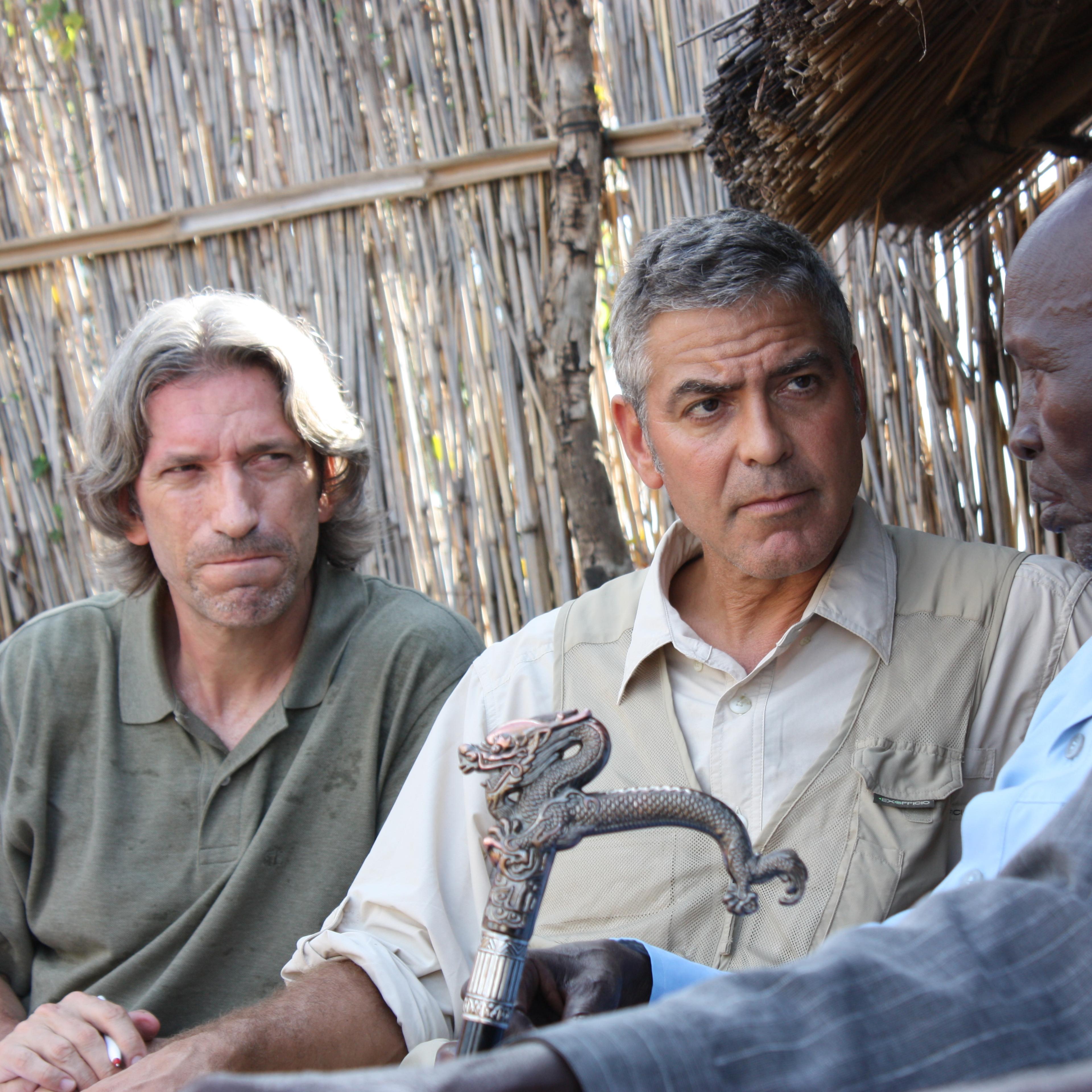 Prendergast, left, and Clooney meet with Sudanese elders