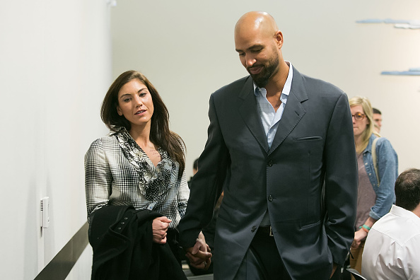 Hope Solo and husband Jerramy Stevens exit the court room at Kirkland Municipal Court in Washington on Nov. 4, 2014