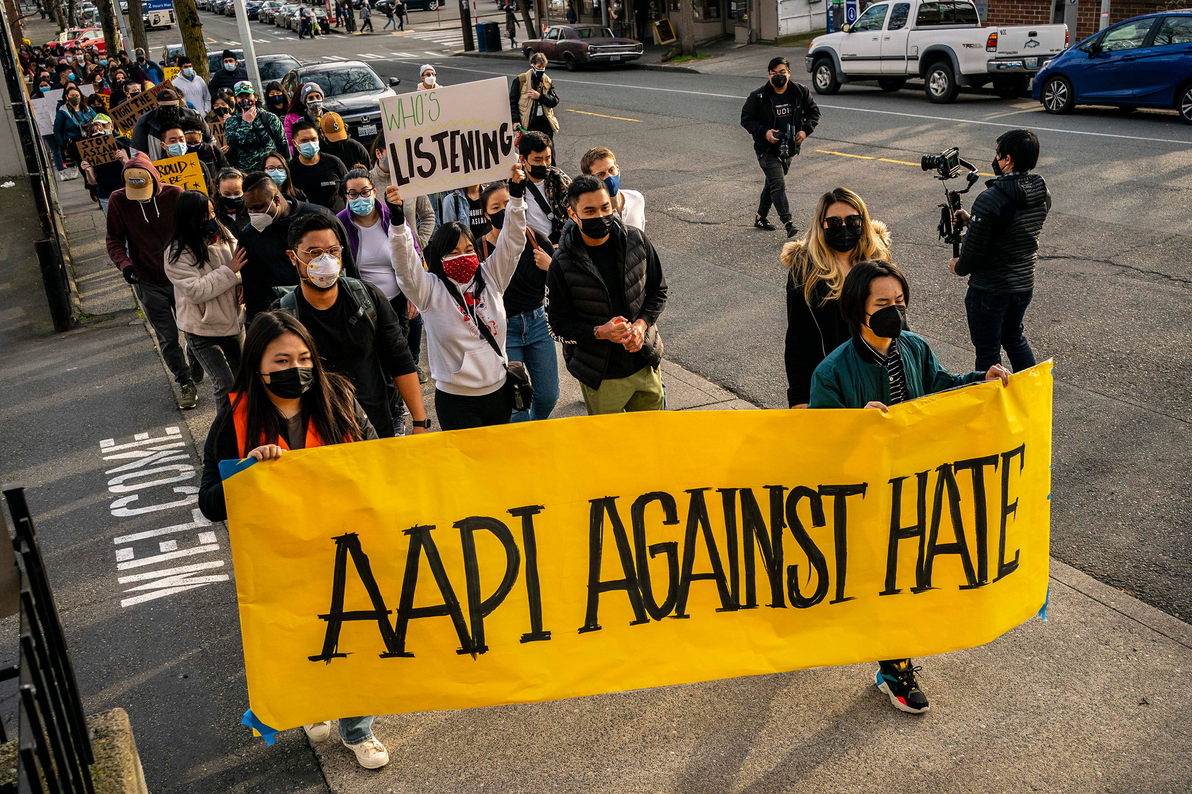 Demonstrators march through the Chinatown-International District during a "We Are Not Silent" rally and march against anti-Asian hate and bias on March 13, 2021 in Seattle, Washington. Following recent attacks on Asian Americans and Pacific Islanders in Seattle and across the U.S., rally organizers planned several days of actions in the Seattle area.