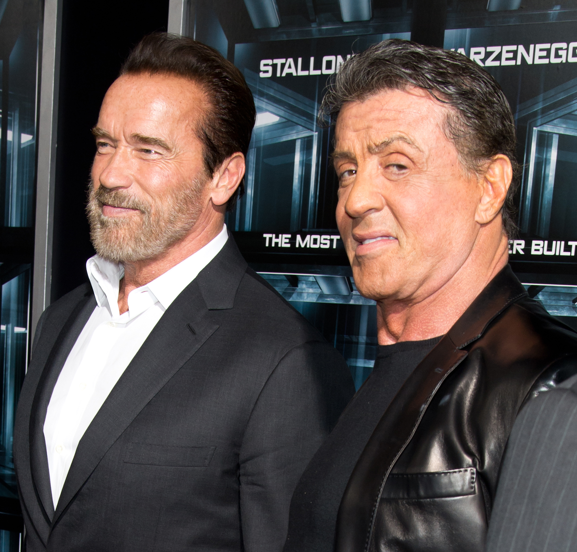 NEW YORK, NY - OCTOBER 15: Actors Arnold Schwarzenegger and Sylvester Stallone attend the "Escape Plan" premiere at Regal E-Walk on October 15, 2013 in New York City.