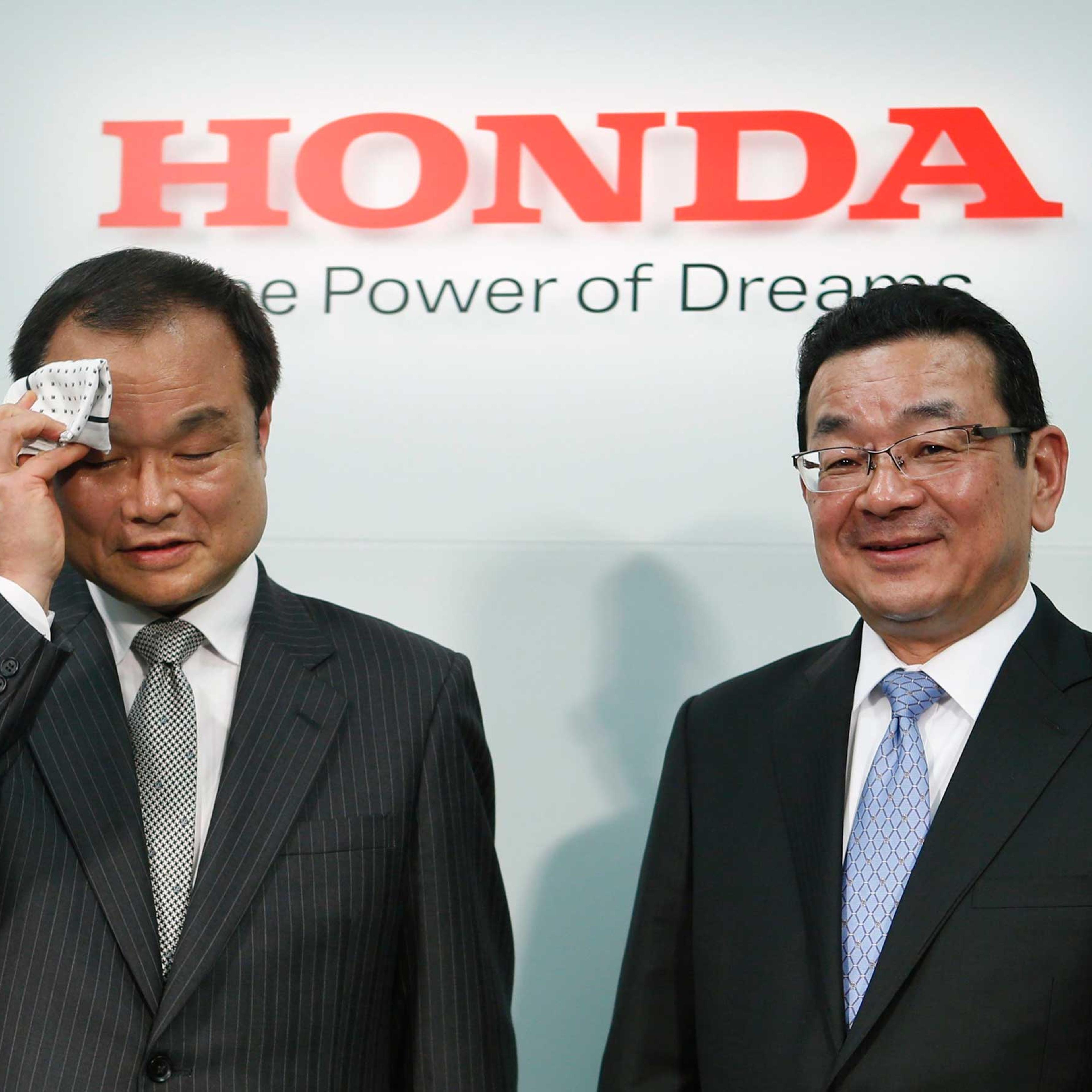 Honda Motor Co's incoming President and Chief Executive Officer Takahiro Hachigo and outgoing President and CEO Takanobu Ito attend a news conference at the company's headquarters in Tokyo, Feb. 23, 2015.