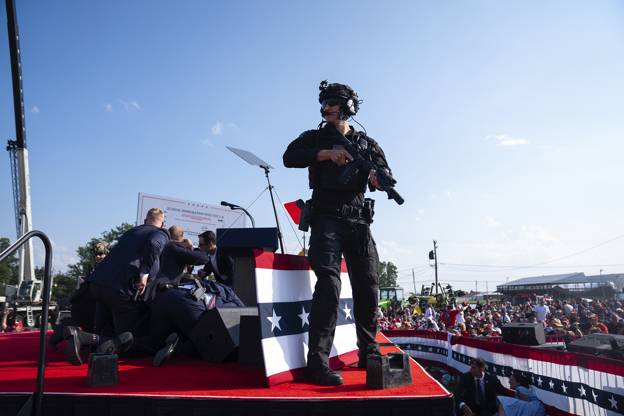Secret Service surrounds Trump after shots were fired at the Butler, Pa., rally on July 13