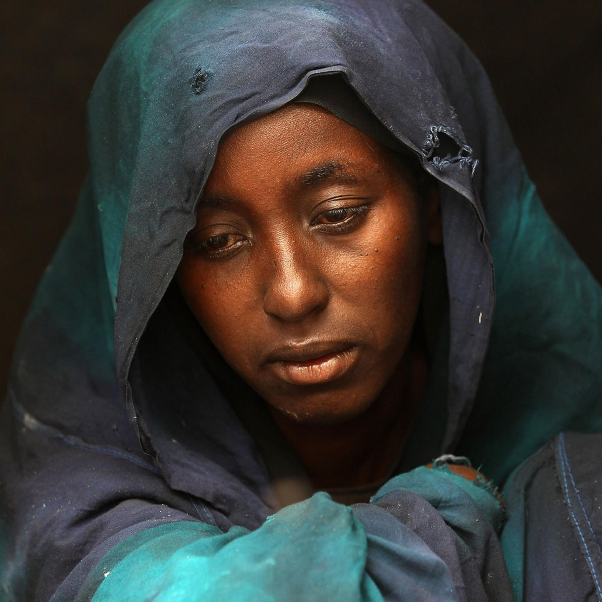 Safia Adem mourns the death of her son Hamza Ali Faysal, 3, in a camp of displaced Somalis within the rubble of the Cathedral of Mogadishu on August 13, 2011 in Mogadishu, Somalia. The malnourished child died of sickness two weeks after fleeing with his family from famine and drought in far southern Somalia. The US government estimates that some 30,000 children have died in southern Somalia in the last 90 days from the crisis.