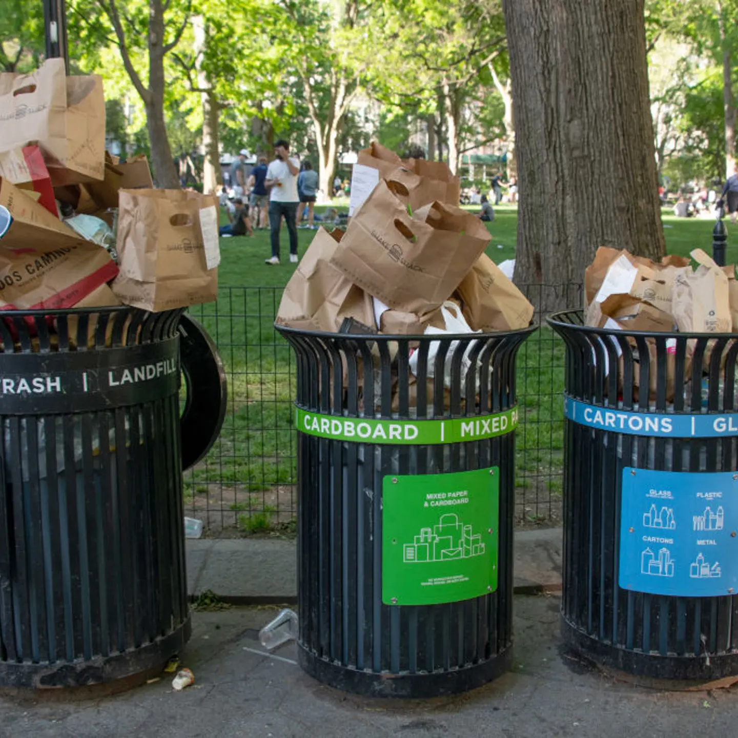 Trash bins overflow with recyclable paper bags on May 16, 2020 in New York City.