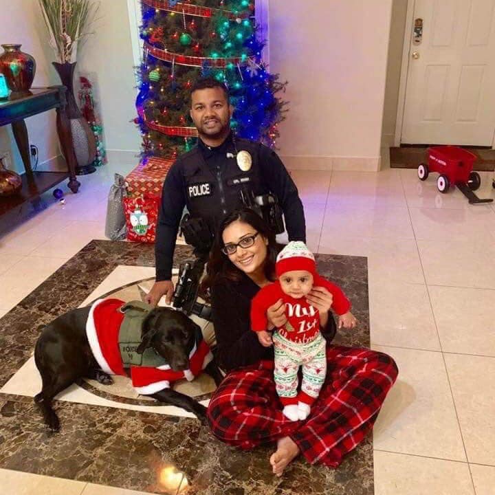 Singh with his wife, 5-month old son and narcotics dog, Sam.