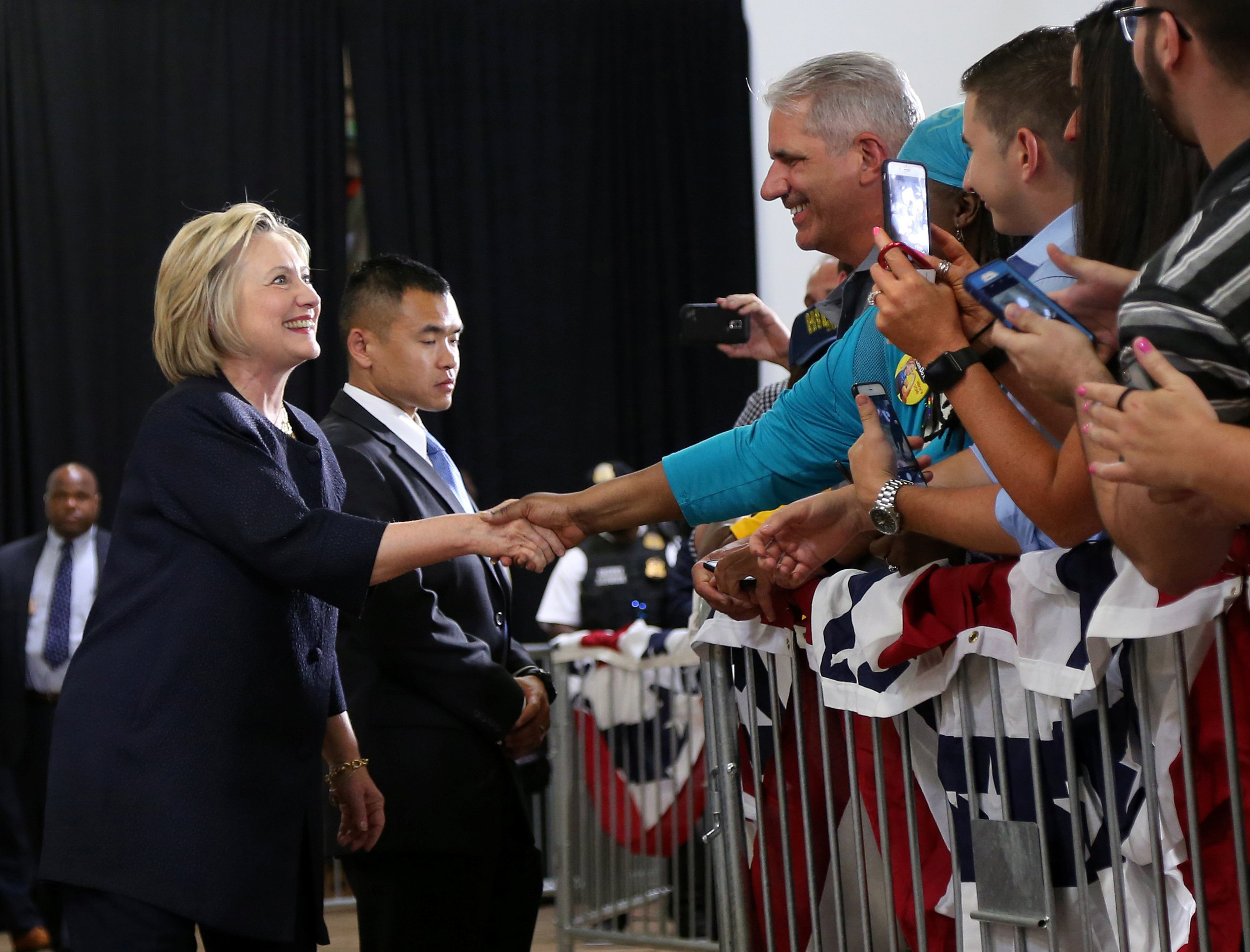 Democratic U.S. presidential candidate Hillary Clinton shakes hands with supporters before speaking at a campaign rally in Cleveland