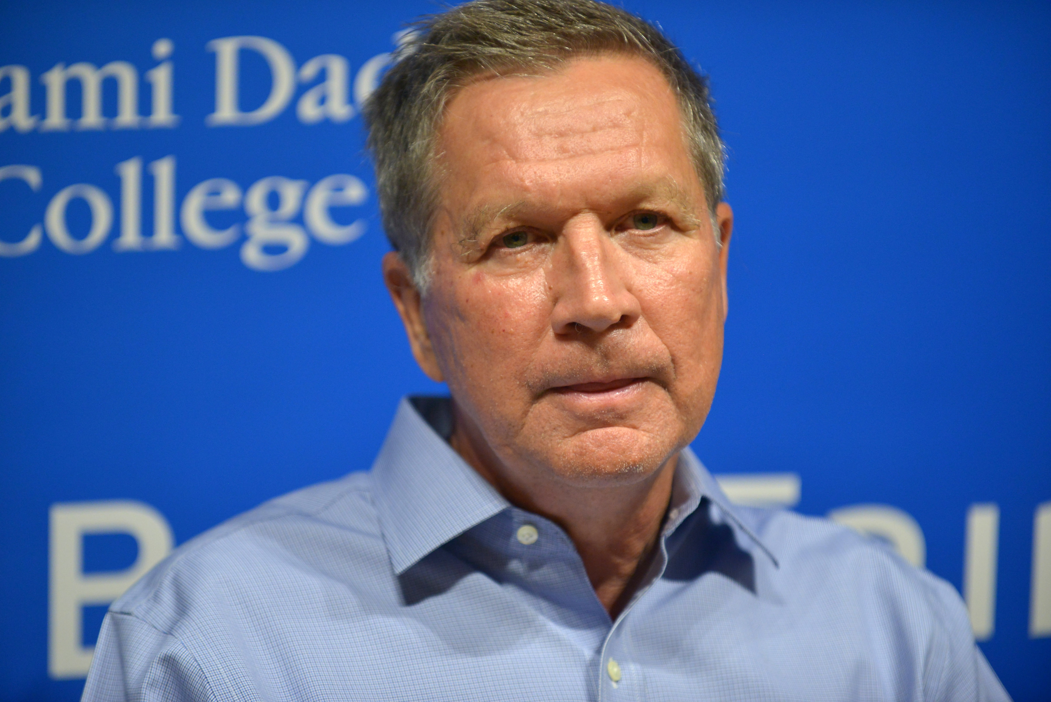 John Kasich Signs "Two Paths: America Divided Or United"