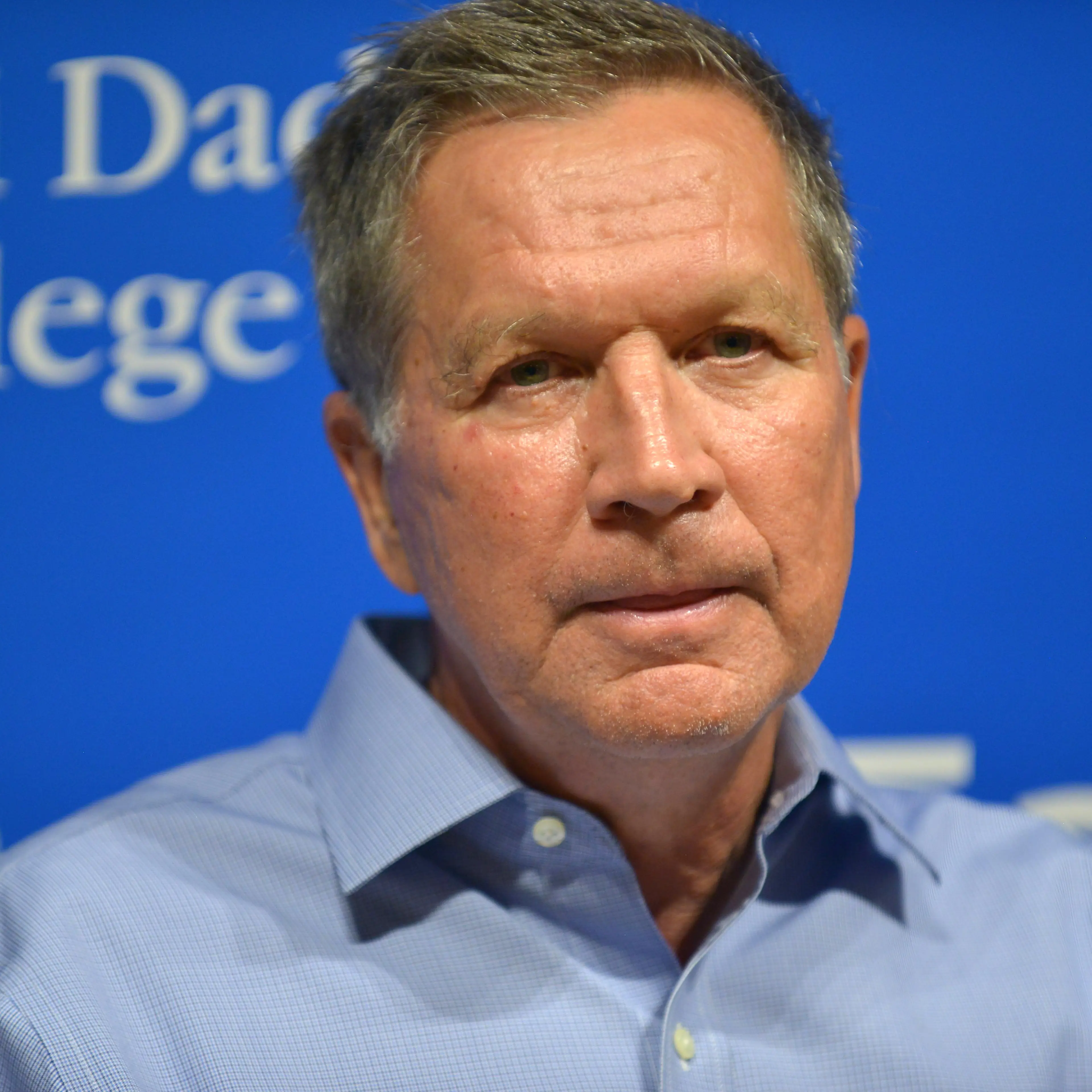 John Kasich Signs "Two Paths: America Divided Or United"