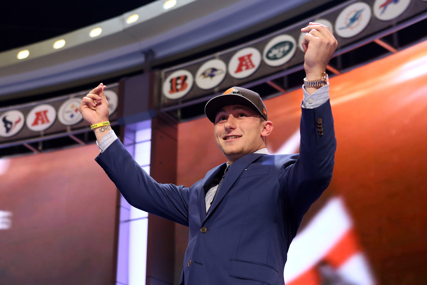 Johnny Manziel gestures on stage after being selected as the number twenty-two overall pick in the first round of the 2014 NFL Draft to the Cleveland Browns at Radio City Music Hall