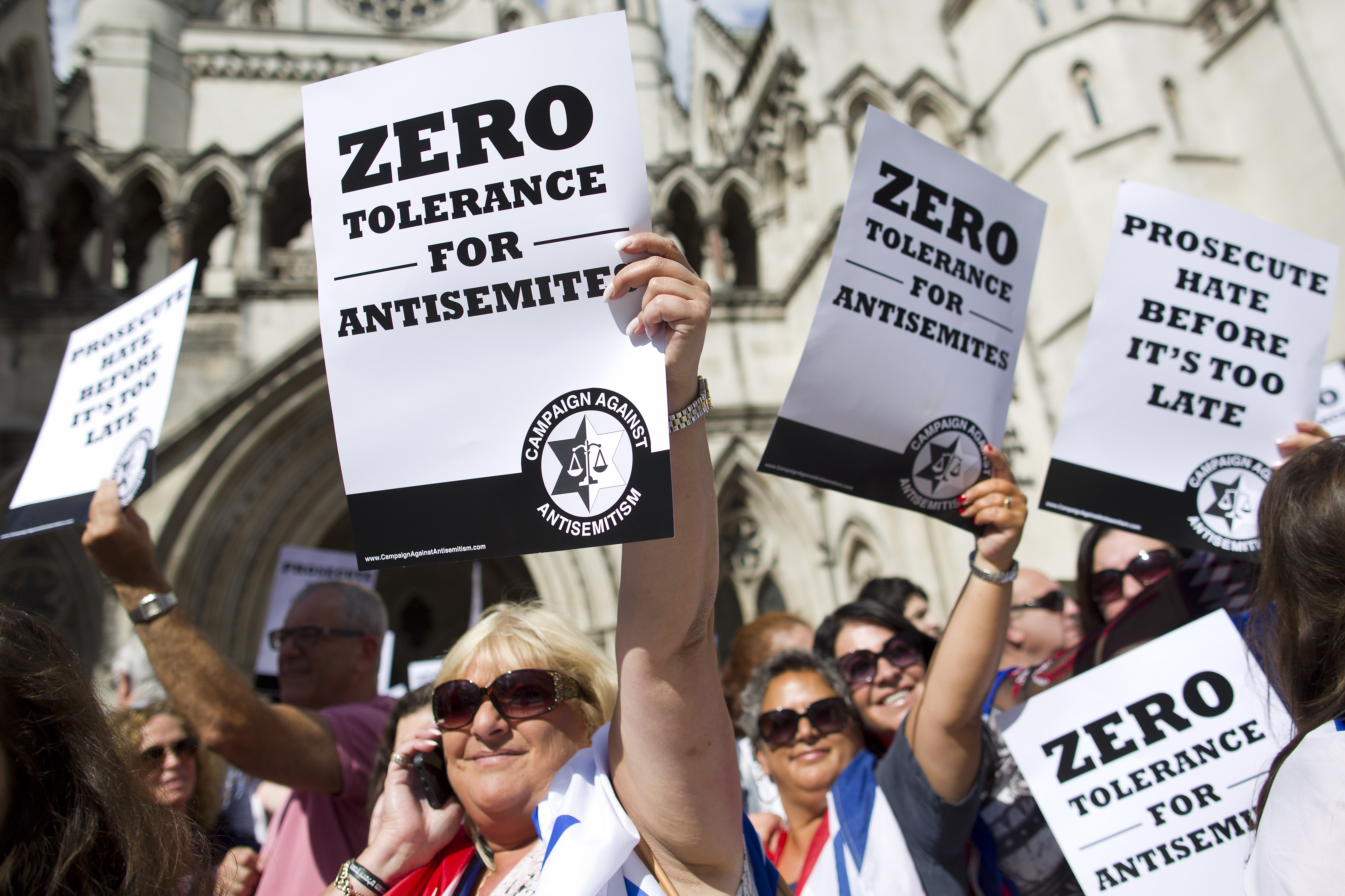 Jewish groups protest outside the Royal Courts of Justice in London on August 31, 2014, as they call for "Zero Tolerance for Anti-Semitism". Jewish groups demonstrated outside the British High Court as latest figures published by the Community Security T