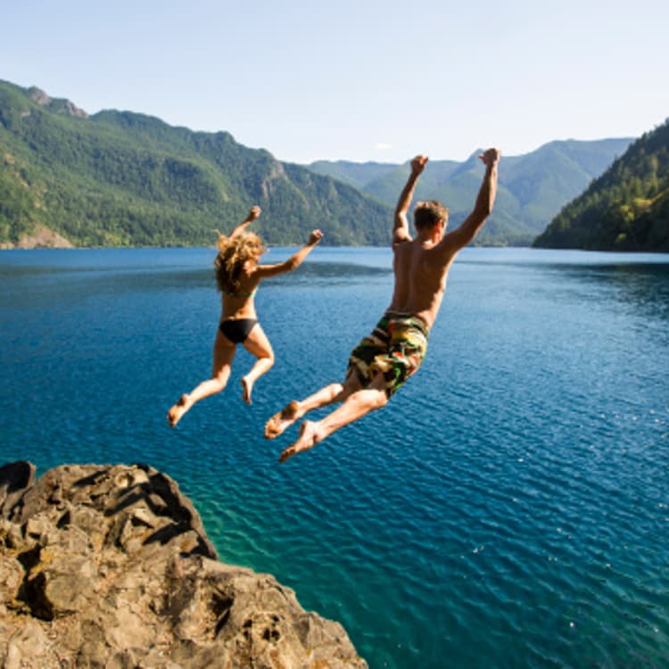 woman-man-jumping-off-cliff