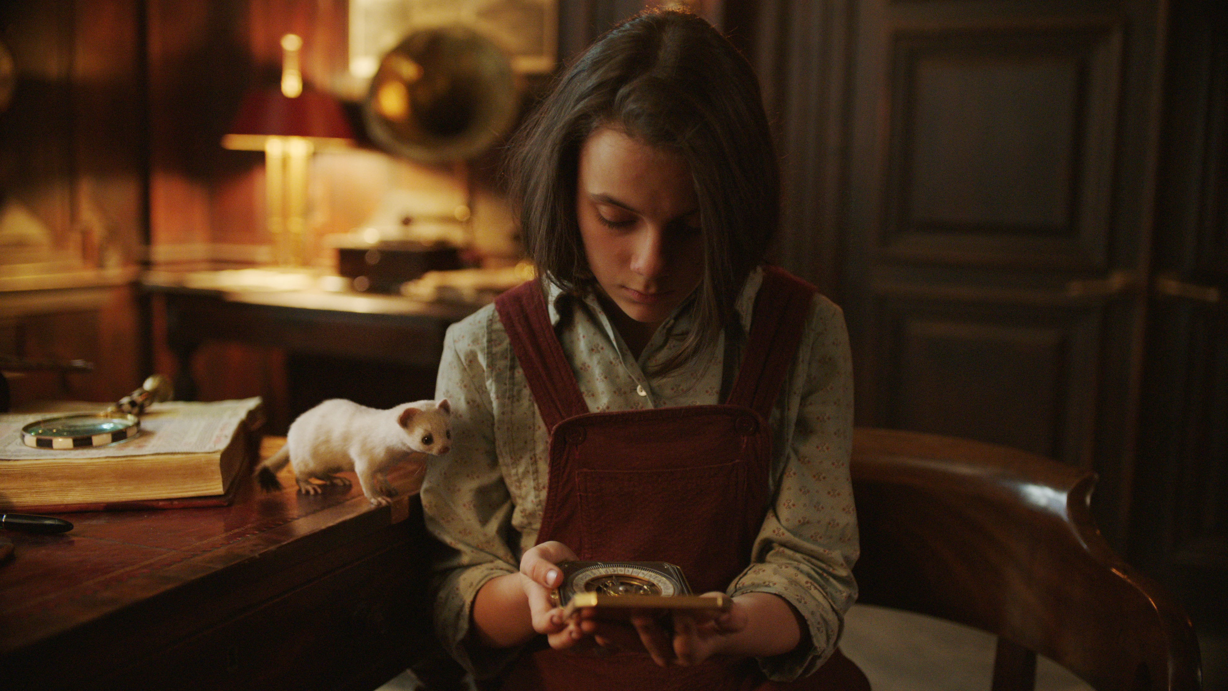 Lyra (Keen) and her alethiometer in 'His Dark Materials'