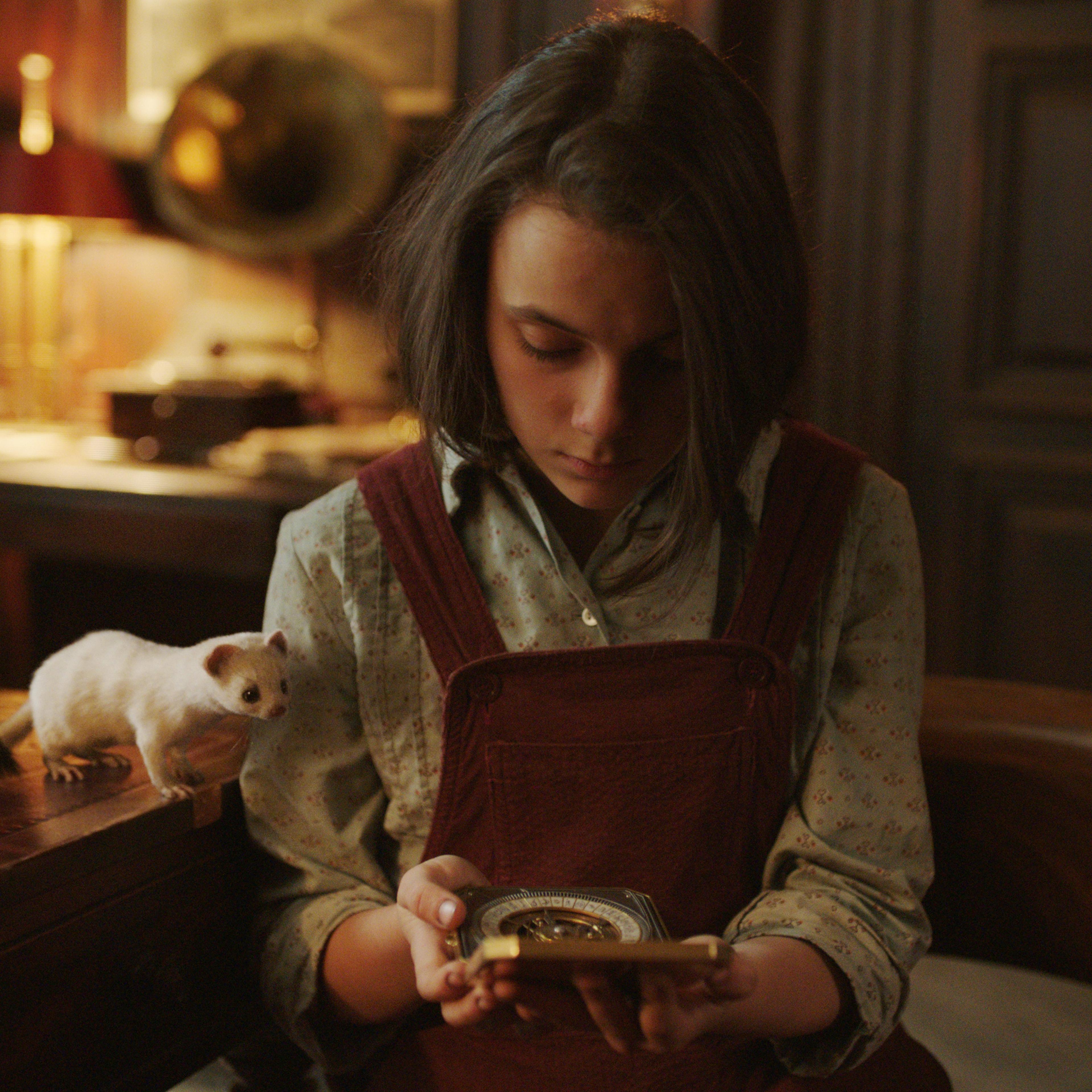 Lyra (Keen) and her alethiometer in 'His Dark Materials'