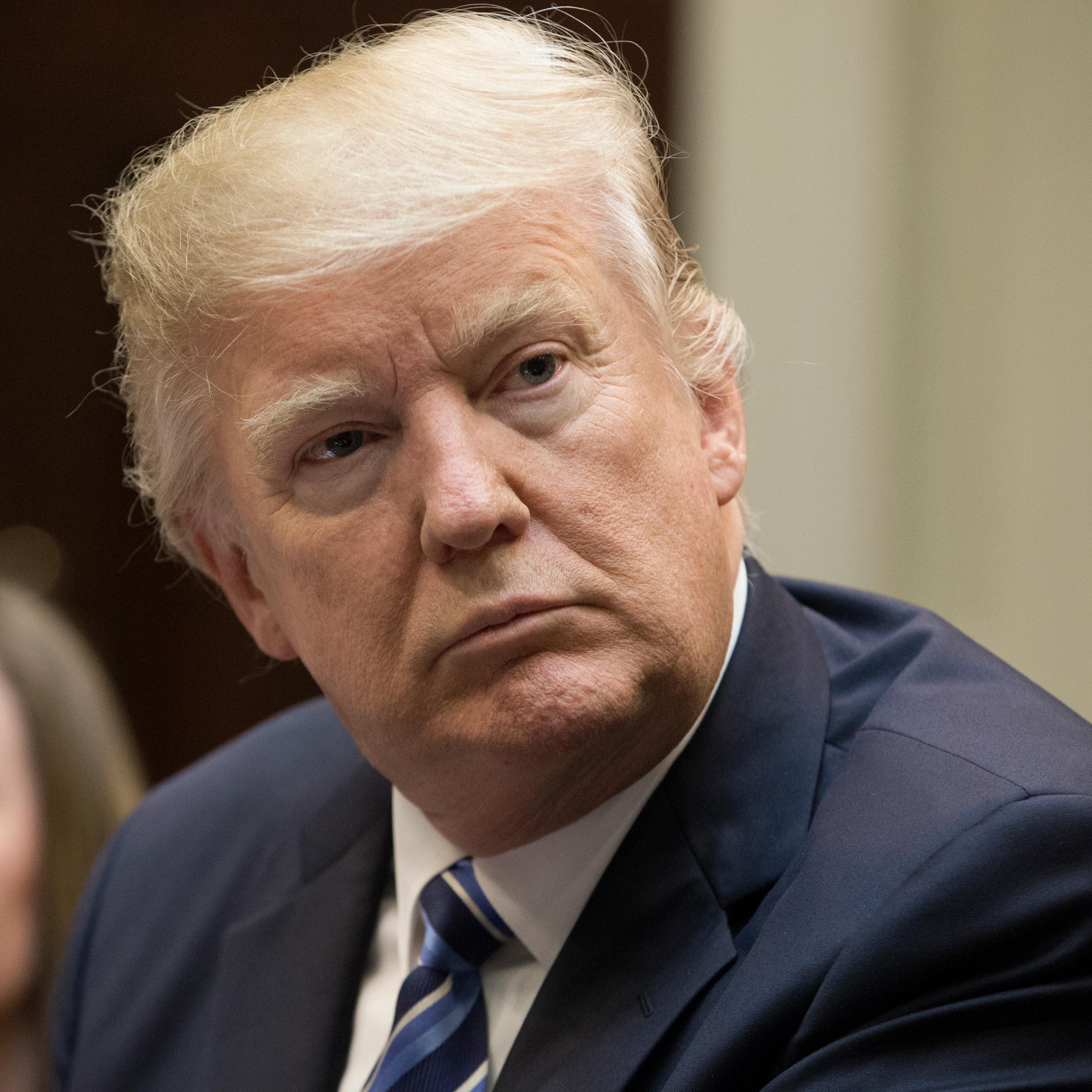 President Donald Trump attends a meeting on healthcare in the Roosevelt Room of the White House on March 13, 2017 in Washington, DC.