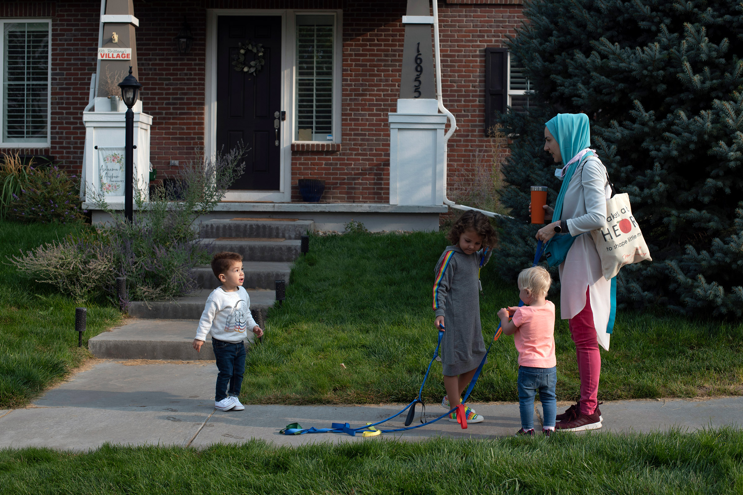 Brittany Schultz, owner of Ms. Brittany’s Village, a home day care in Colorado, walks the kids to a park on Sept. 17