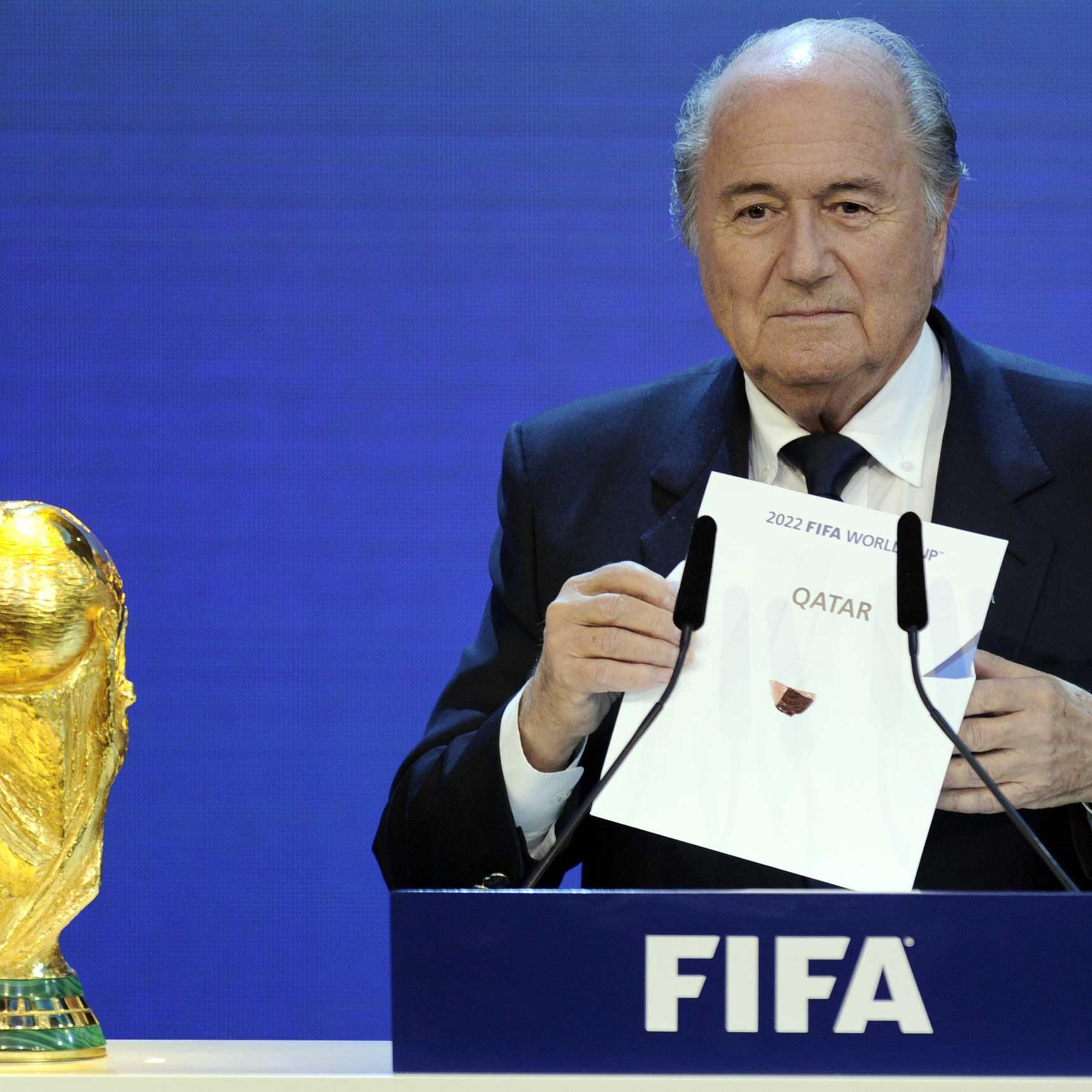 FIFA President Sepp Blatter holding up the name of Qatar during the official announcement of the 2022 World Cup host country at the FIFA headquarters in Zurich, Dec. 2, 2010.