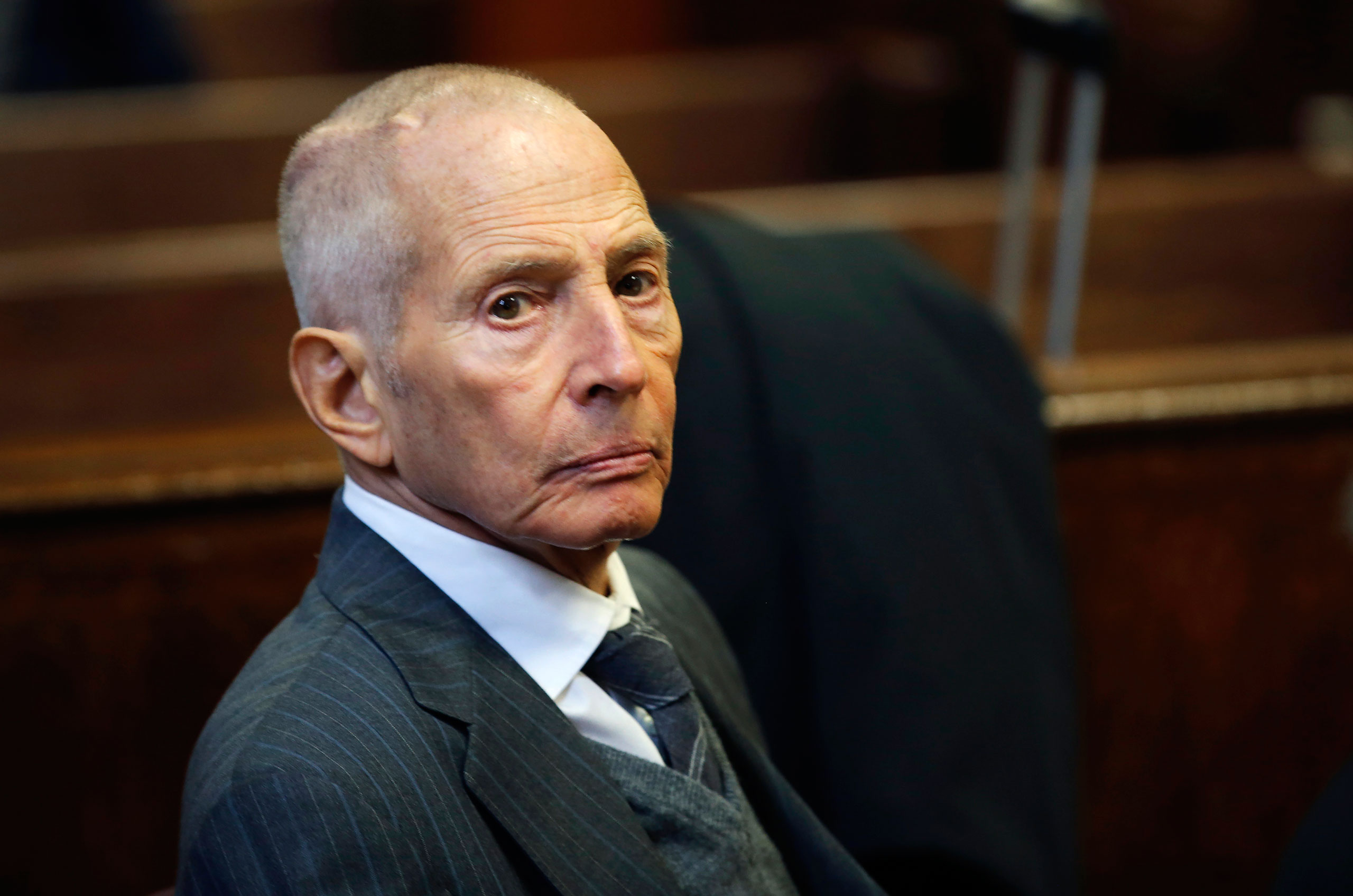 Real estate heir Robert Durst appears in a criminal courtroom for his trial on charges of trespassing on property owned by his estranged family, in New York