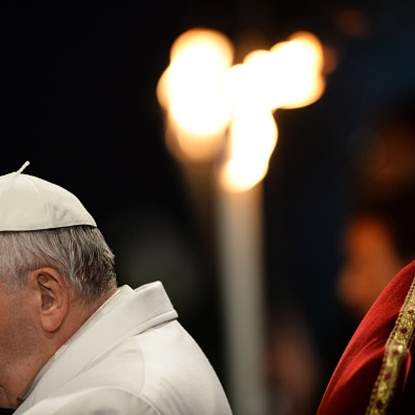 Pope Francis prays during the Way of the Cross torchlight procession at the Colosseum on Good Friday on April 3, 2015 in Rome.