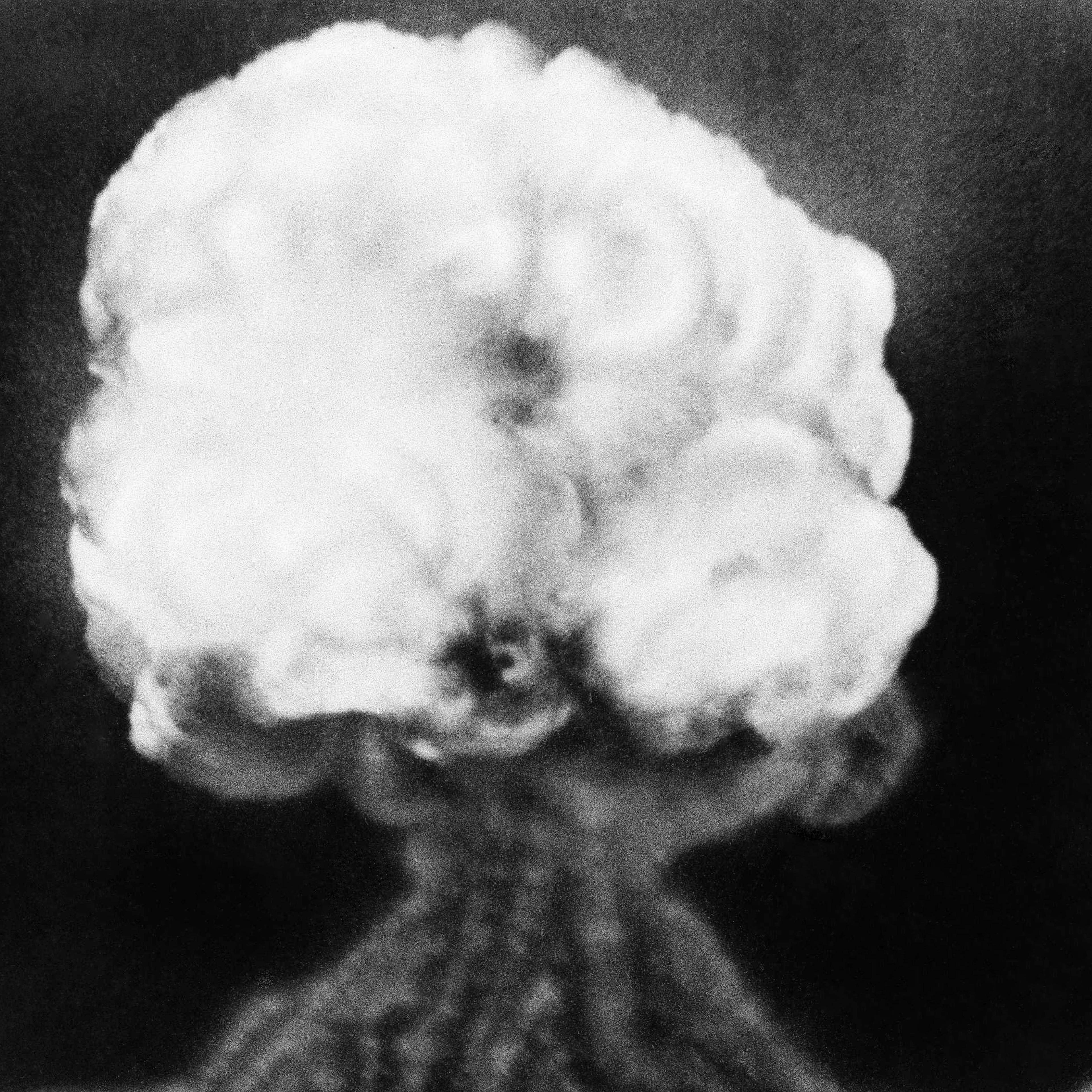 This is the mushroom cloud of the first atomic explosion at Trinity Test Site, New Mexico on July 16, 1945. It left a half-mile wide crater, ten feet deep at the vent and the sand within the crater had been burned and boiled into a highly radioactive, ja