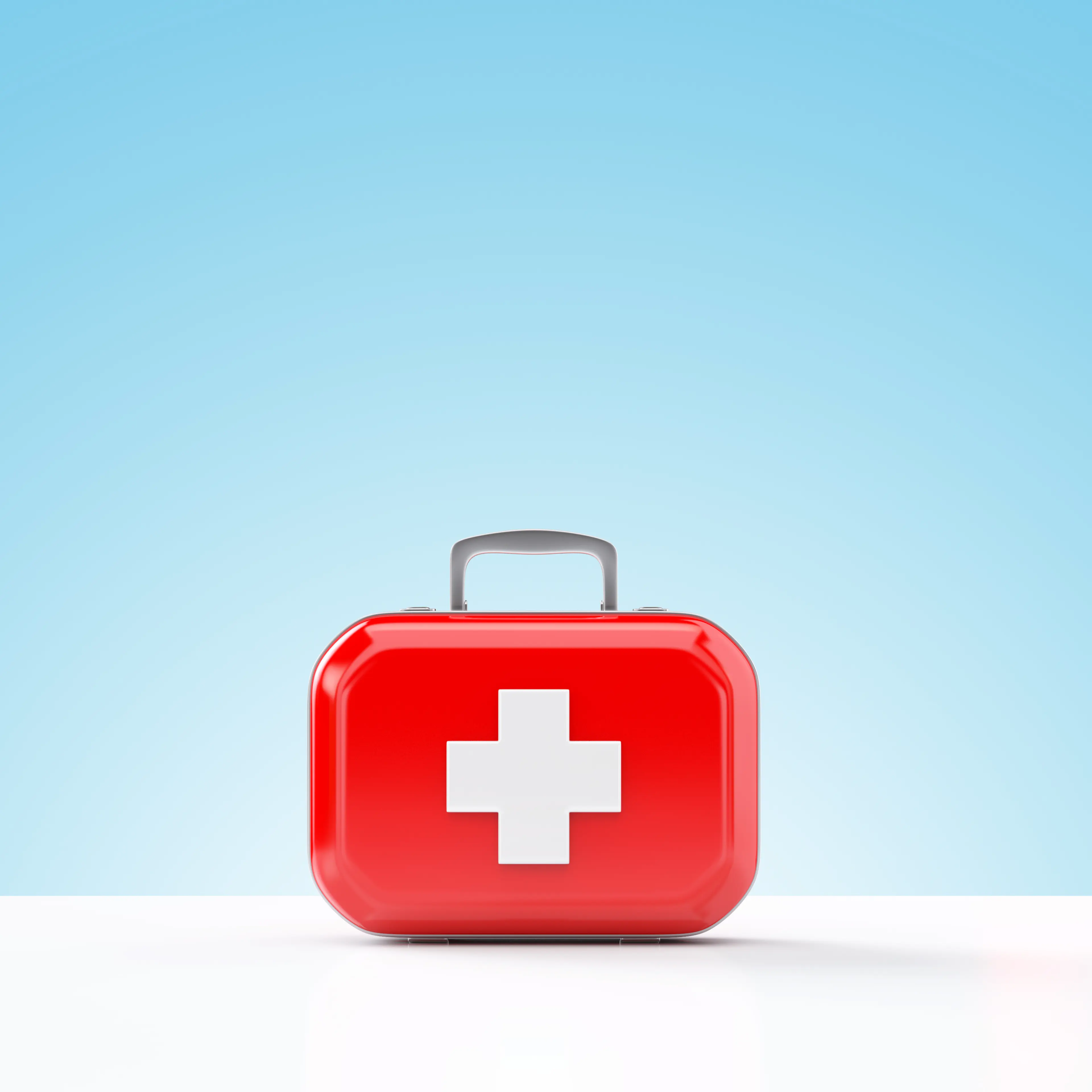 First aid kit standing on a blue and white background TIME health stock