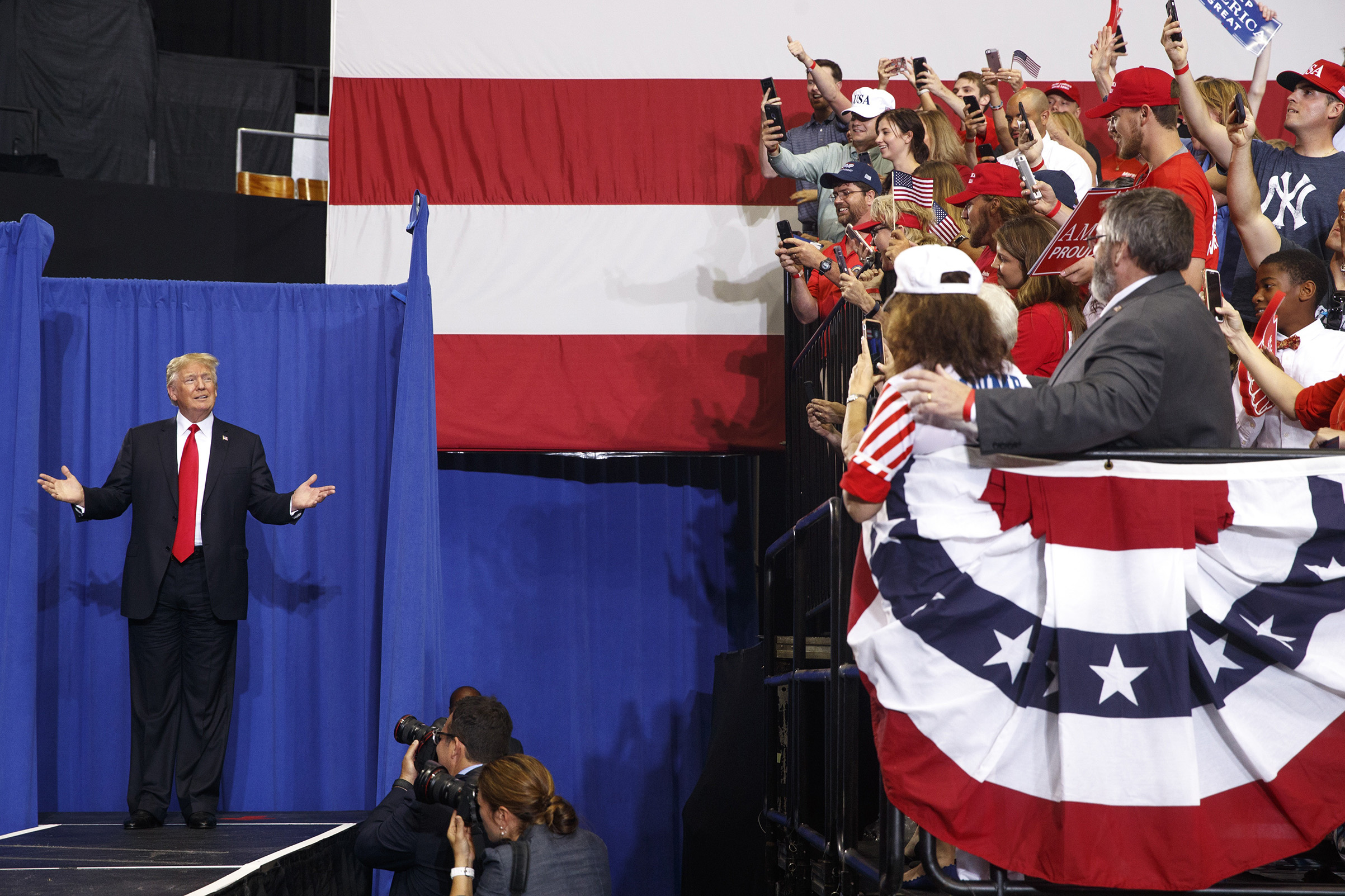 President Donald Trump arrives on stage at a campaign-style rally at the Nashville Municipal Auditorium in Nashville, Tenn., May 29, 2018.