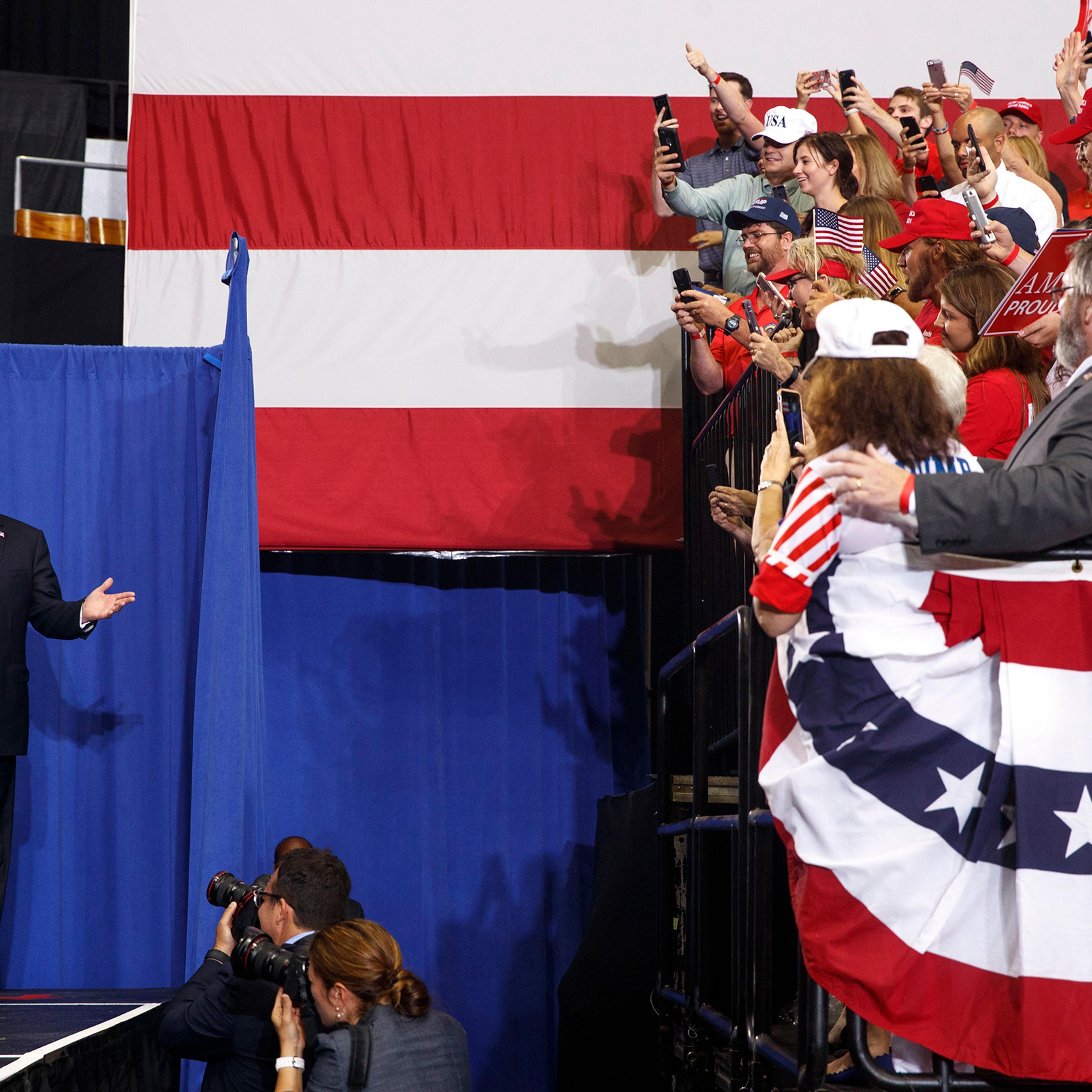 President Donald Trump arrives on stage at a campaign-style rally at the Nashville Municipal Auditorium in Nashville, Tenn., May 29, 2018.