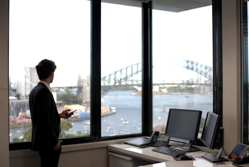 businessman-looking-out-window
