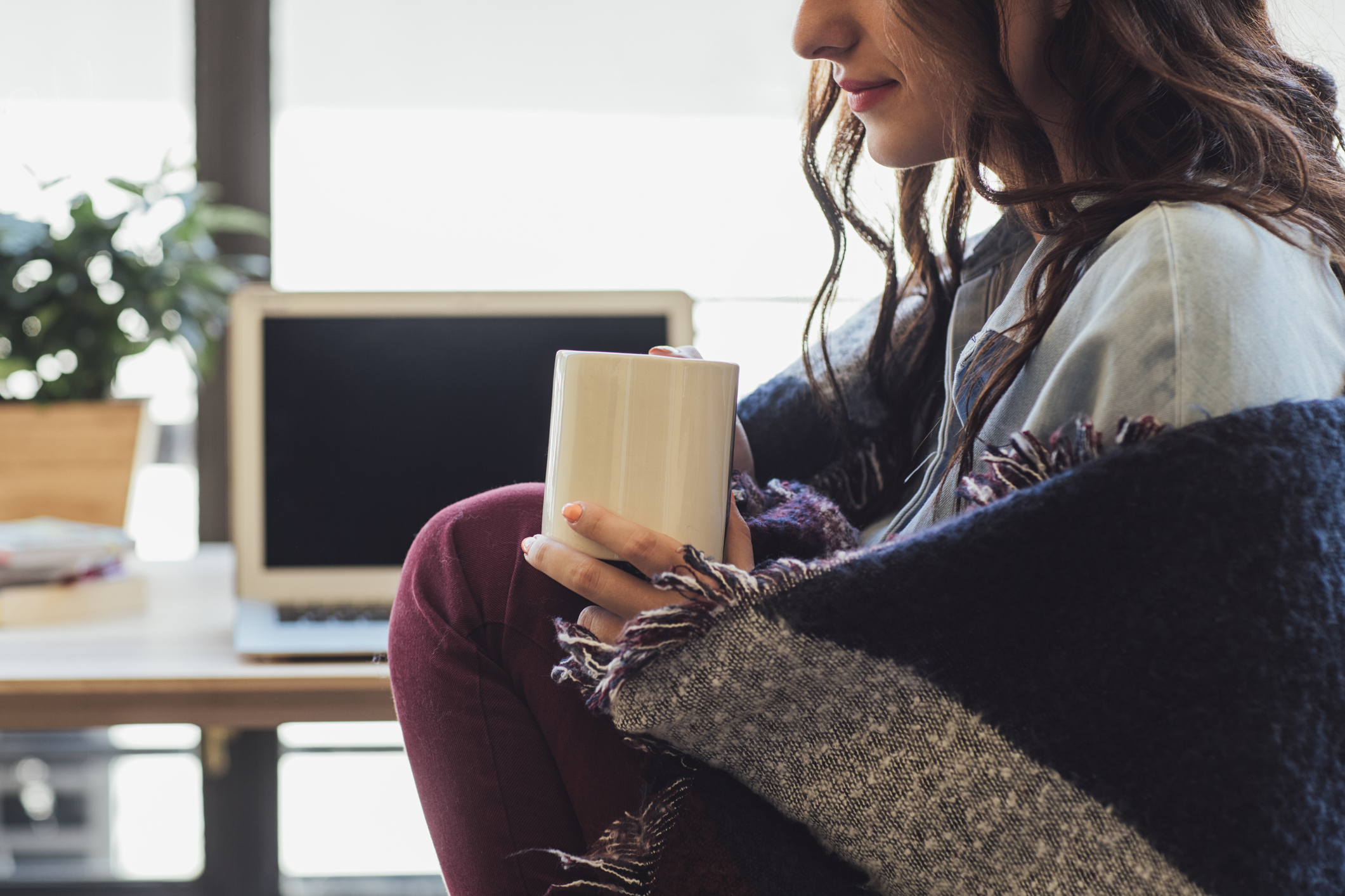 Woman working in a cold office