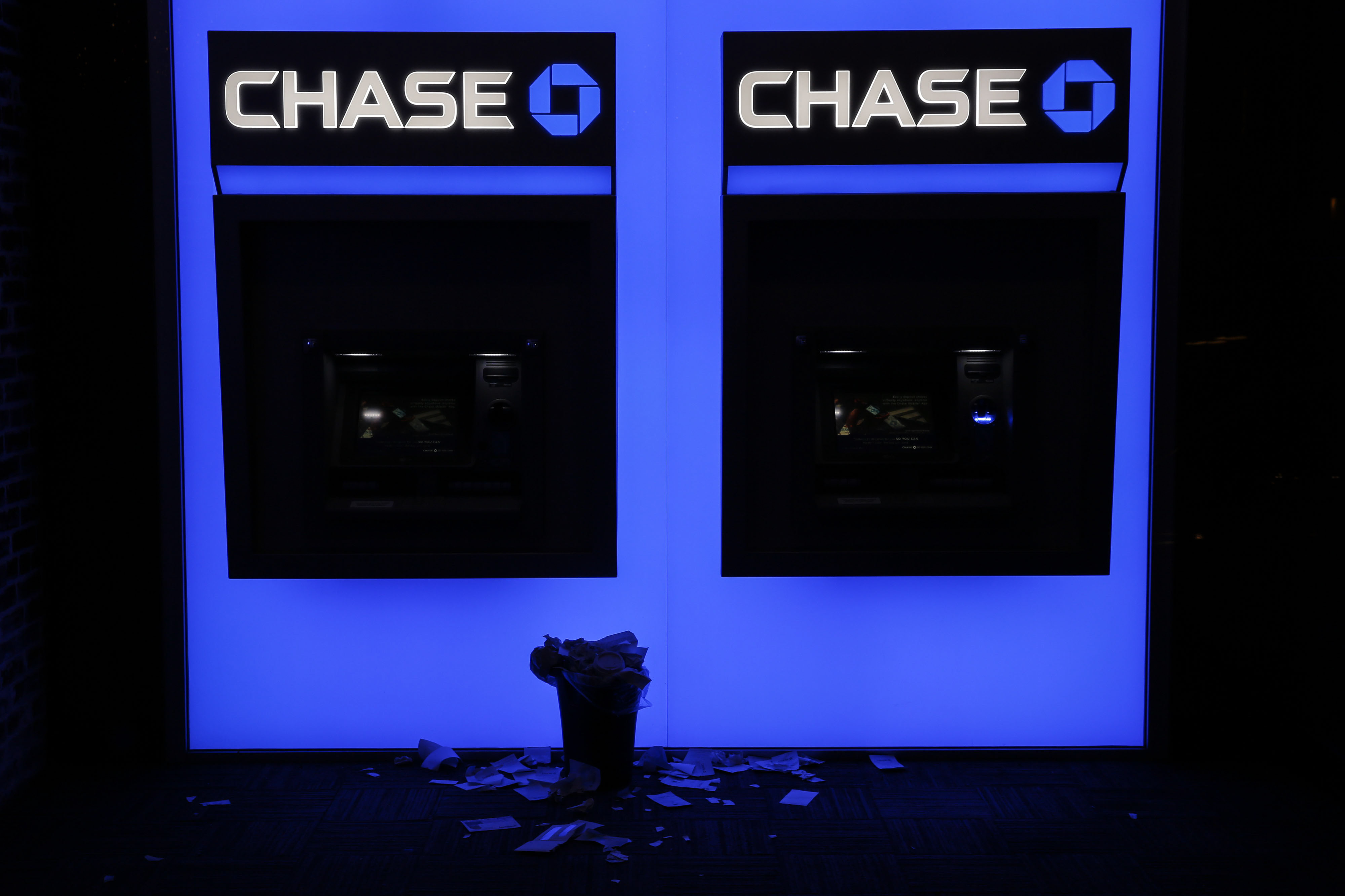 Receipts rest beneath JPMorgan Chase &amp; Co. bank ATMs in San Diego, California, U.S., on Wednesday, July 8, 2015.