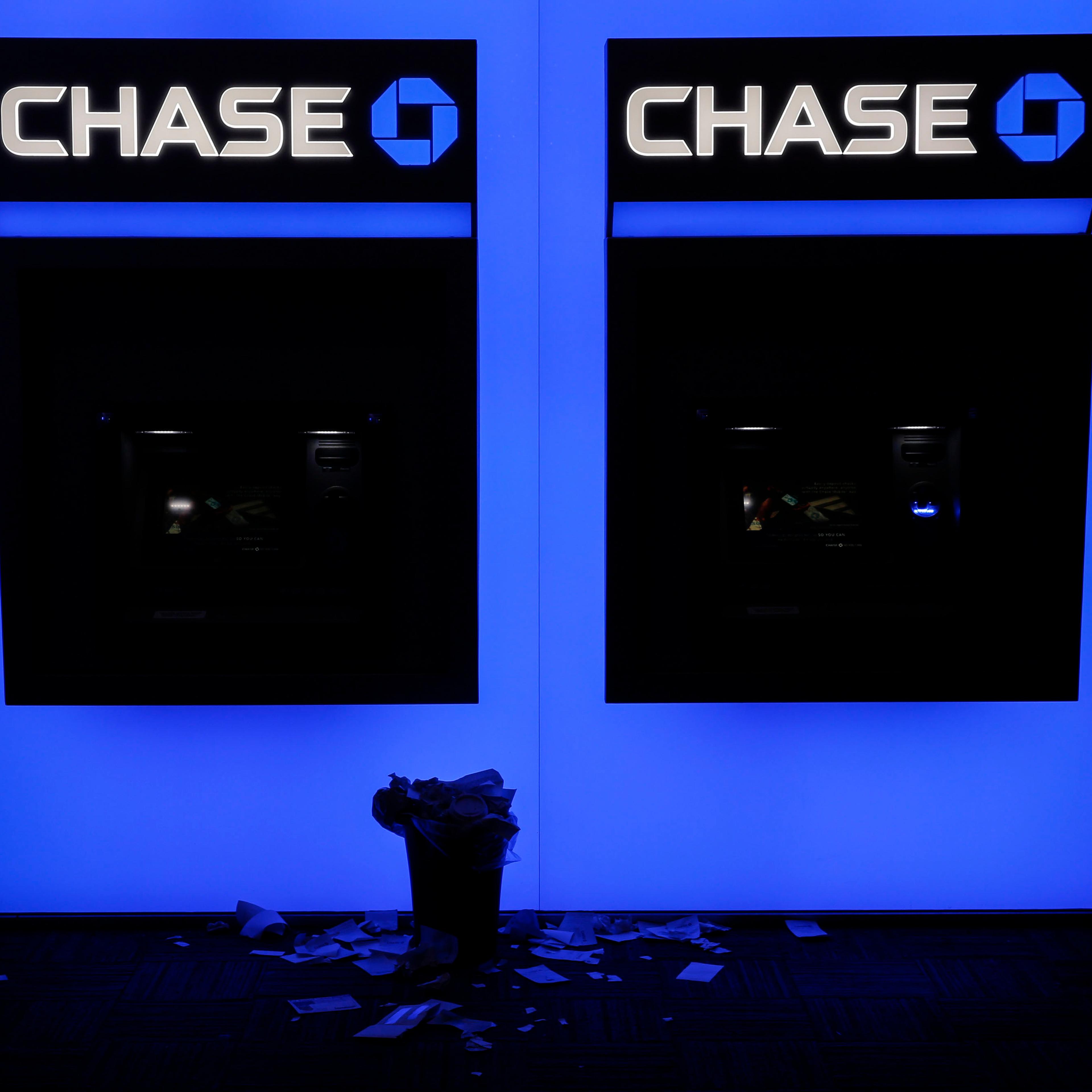Receipts rest beneath JPMorgan Chase & Co. bank ATMs in San Diego, California, U.S., on Wednesday, July 8, 2015.