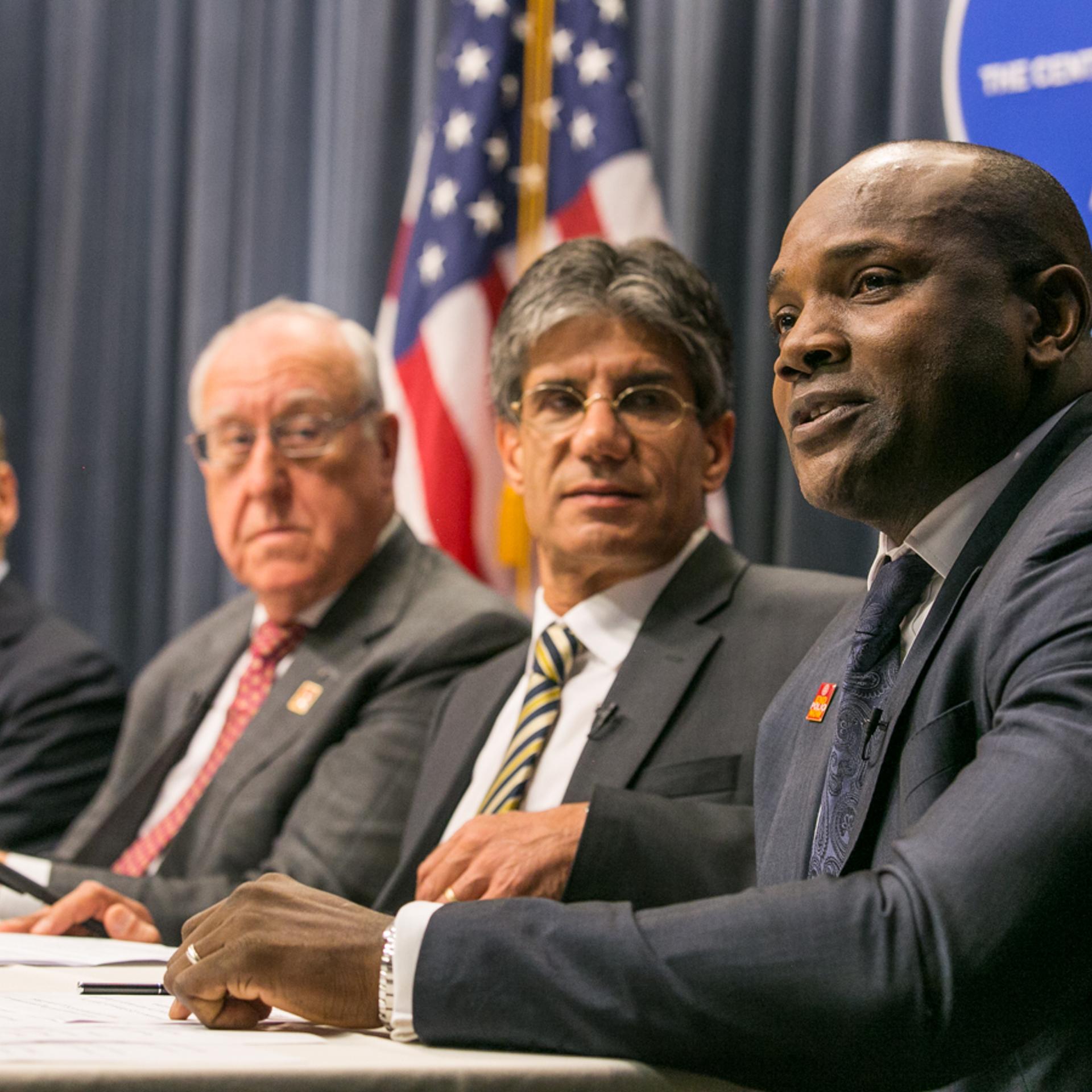 Dennis Ogbe, right, during a World Polio Day panel at the CDC
