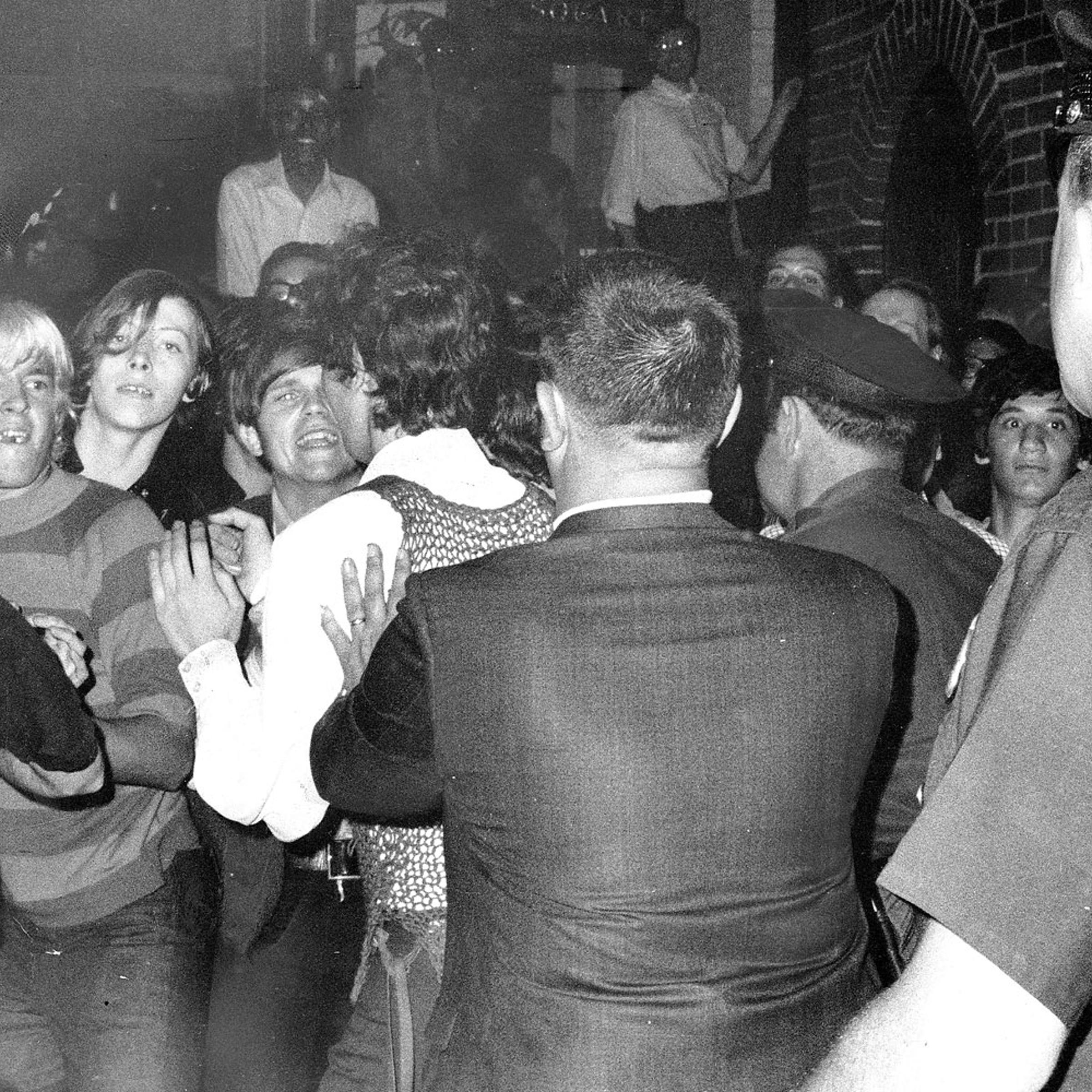 Stonewall Inn nightclub raid. Crowd attempts to impede polic
