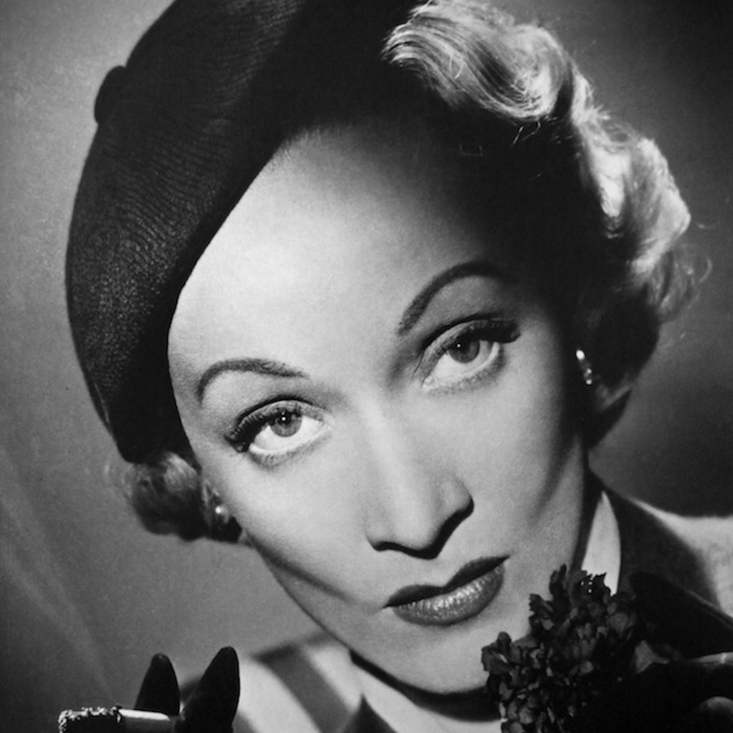 <b>Marlene Dietrich, 1948</b></br></br><i>"I first had the opportunity to photograph Marlene Dietrich whilst working at Denham Studios. I rushed into the studio and was given a set on a small corner of an enormous 120 ft. by 80 ft. stage. I was nervous. Once set up, I waited in the dark, with my radio at the ready thinking it might help ease the situation and, more importantly, calm my nerves. Suddenly a light came on in the entrance to the studio a hundred feet away, and she and her entourage proceeded across the stage. <br /><br /> I only took five photographs of her that day. The shoot finished and she announced she would be back the next day to see the rough prints. I re-touched the prints following her explicit and detailed instructions to a tee. The next day Dietrich arrived, took out her magnifying glass again and re-examined the prints. Pleased, she turned to me, shook my hand and said, 'Join the club Mr. Lucas.' I was rather perplexed and wasn't sure what she meant so asked h