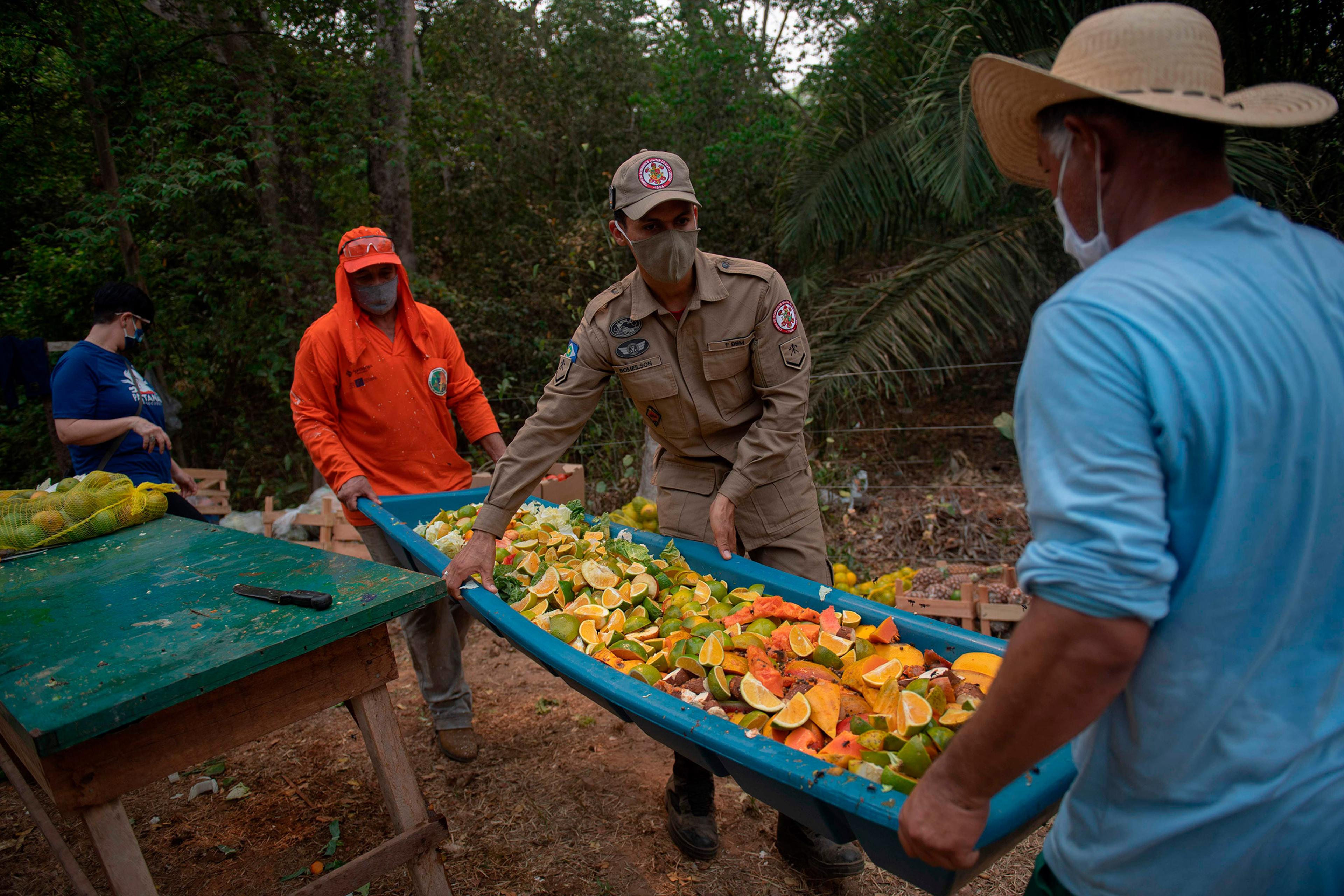 Inmates organize food to be distributed to animals on Sept. 19.