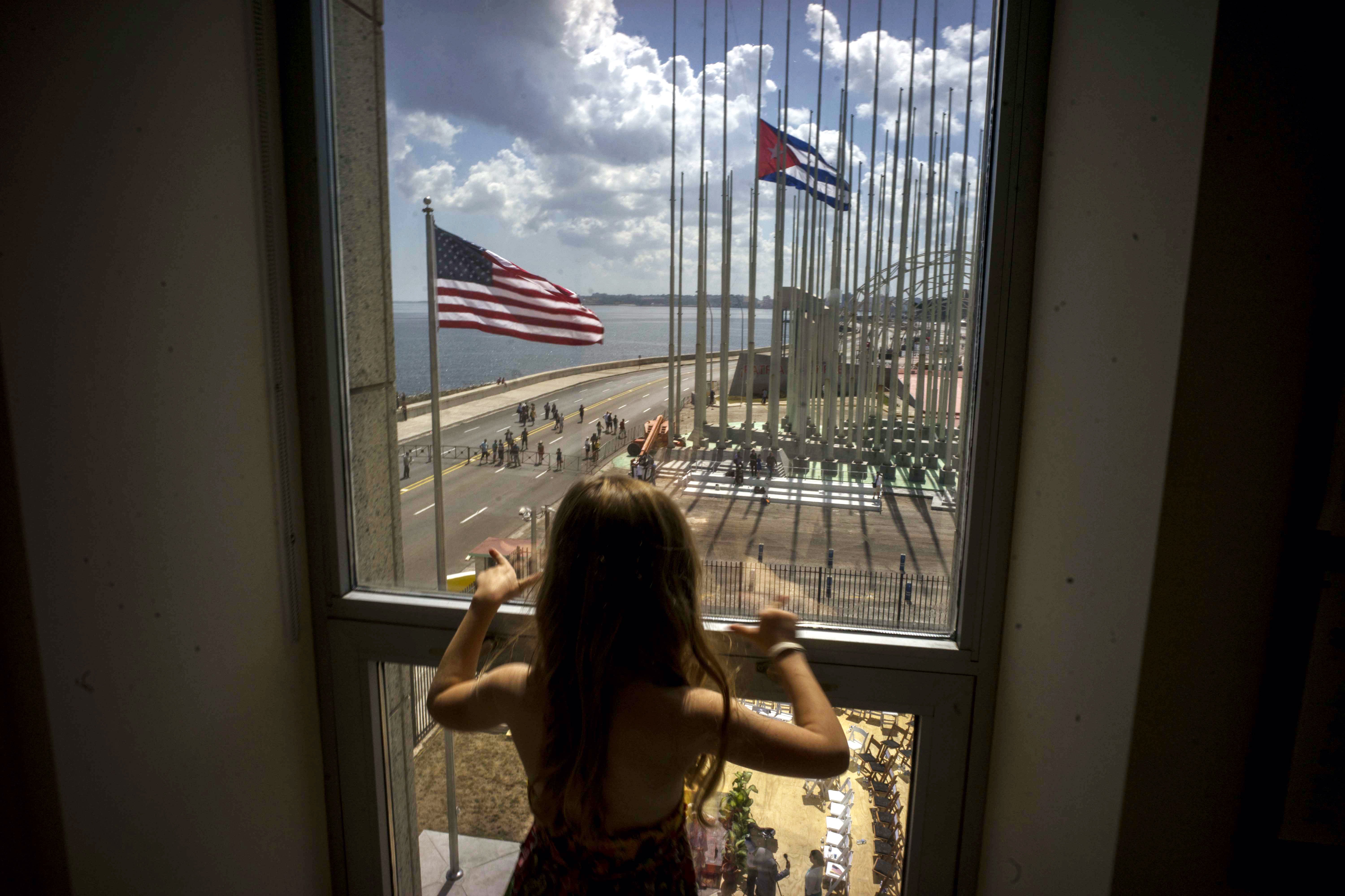 A child looks out at the staging area at the end of a flag raising ceremony, at the newly opened U.S. Embassy, in Havana on Aug. 14, 2015.