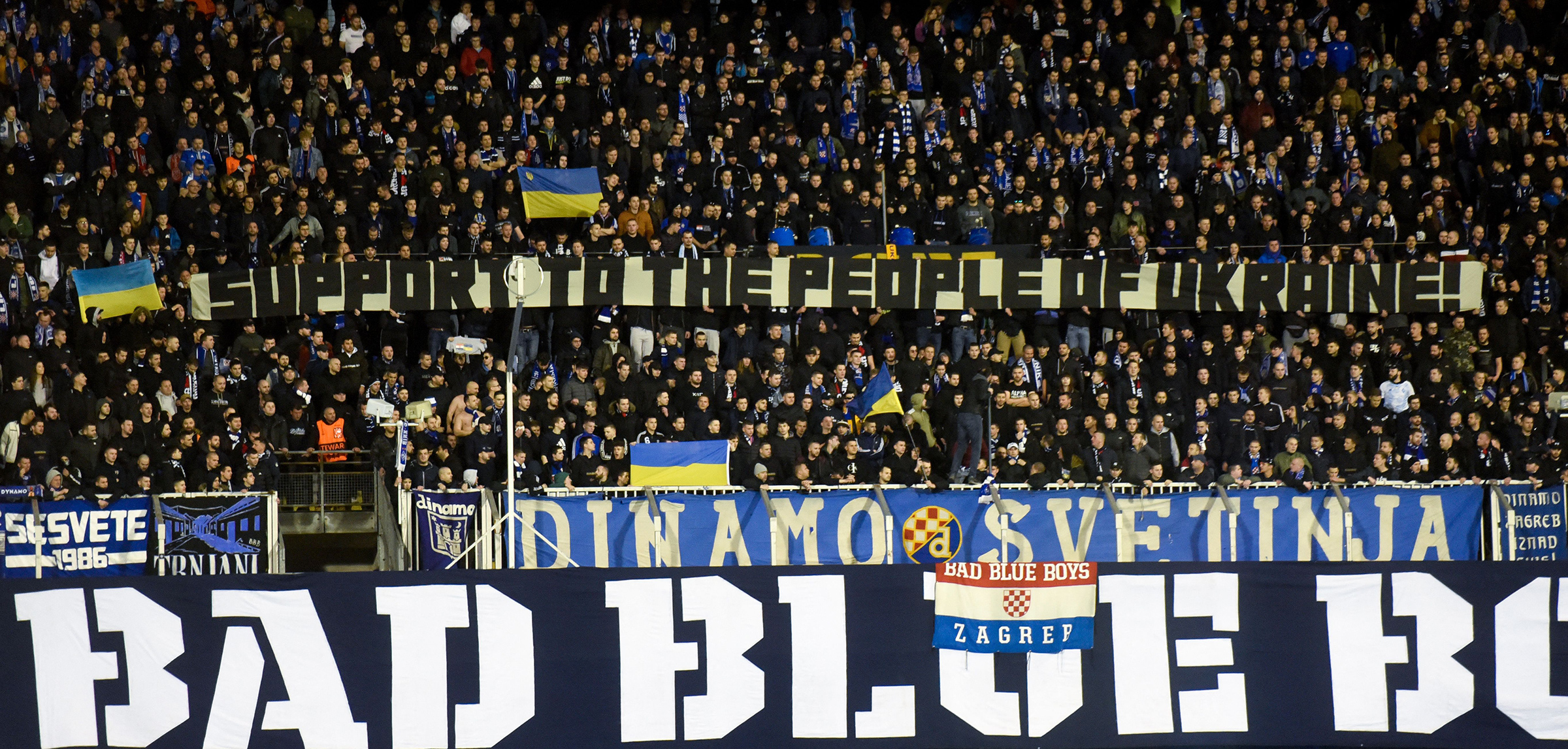 Dinamo Zagreb supporters hold a banner in support of the people of Ukraine during the UEFA Europa League football second leg match between Dinamo Zagreb and Sevilla FC at the Maksimir stadium in Zagreb, Croatia, on Feb. 24