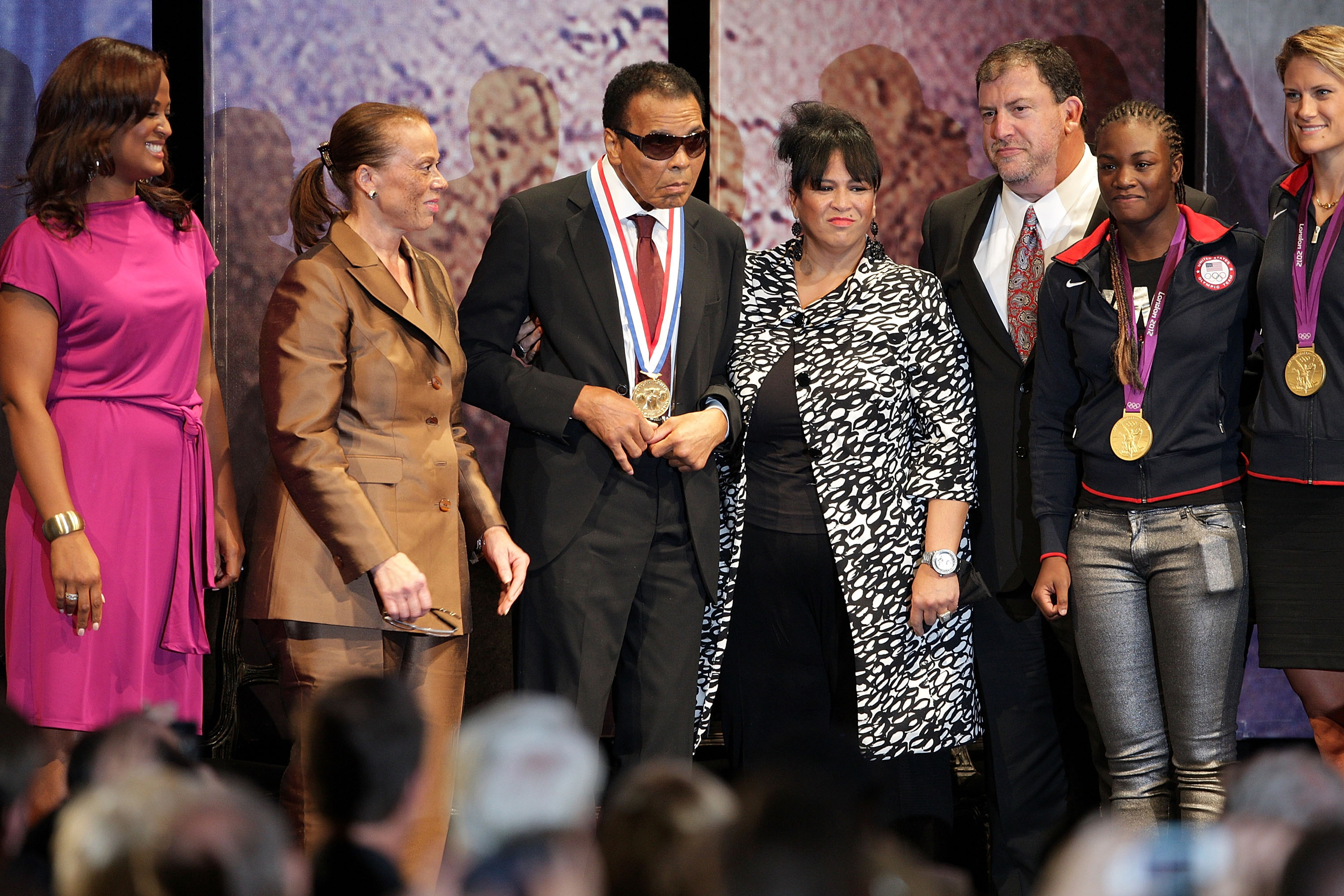 PHILADELPHIA, PA - SEPTEMBER 13: (L-R) Laila Ali, Lonnie Ali, former boxing Champion Muhammad Ali, Marilyn Williams, President and CEO of the Nation Constitution Center David Eisner, Claressa Shields and Susan Francis during the Liberity Medal ceremony a