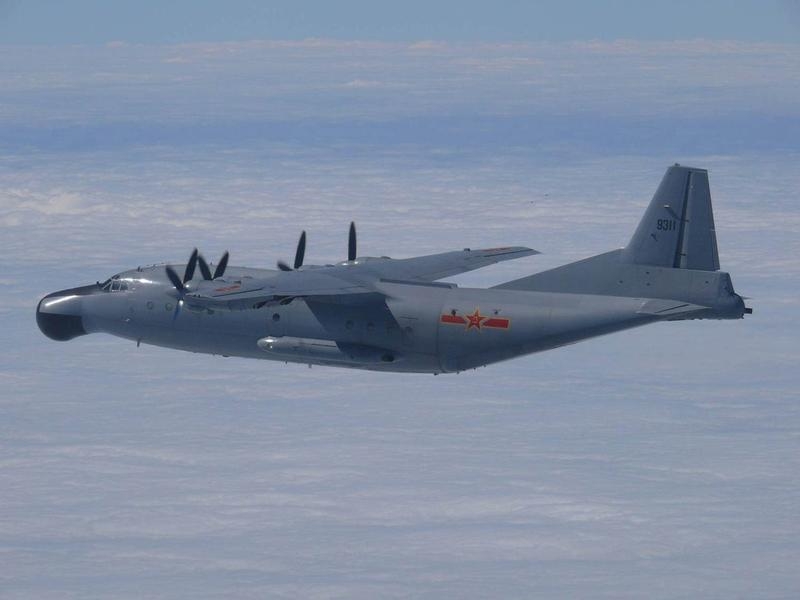 A Chinese military plane Y-8 airborne early warning plane flies through airspace between Okinawa prefecture's main island and the smaller Miyako island in southern Japan