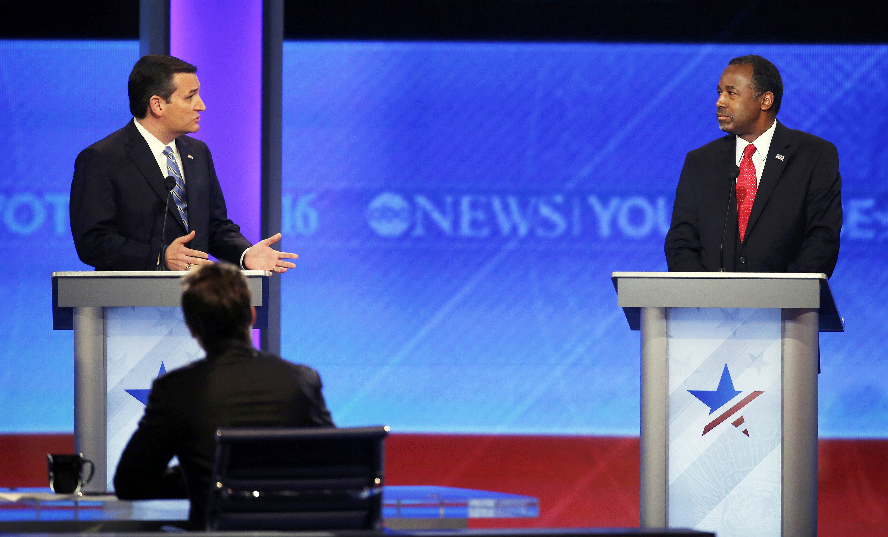 Republican presidential candidates Texas Sen. Ted Cruz and Dr. Ben Carson speak during debate during a Republican presidential debate on Feb. 6, 2016 at Saint Anselm College in Manchester, N.H.