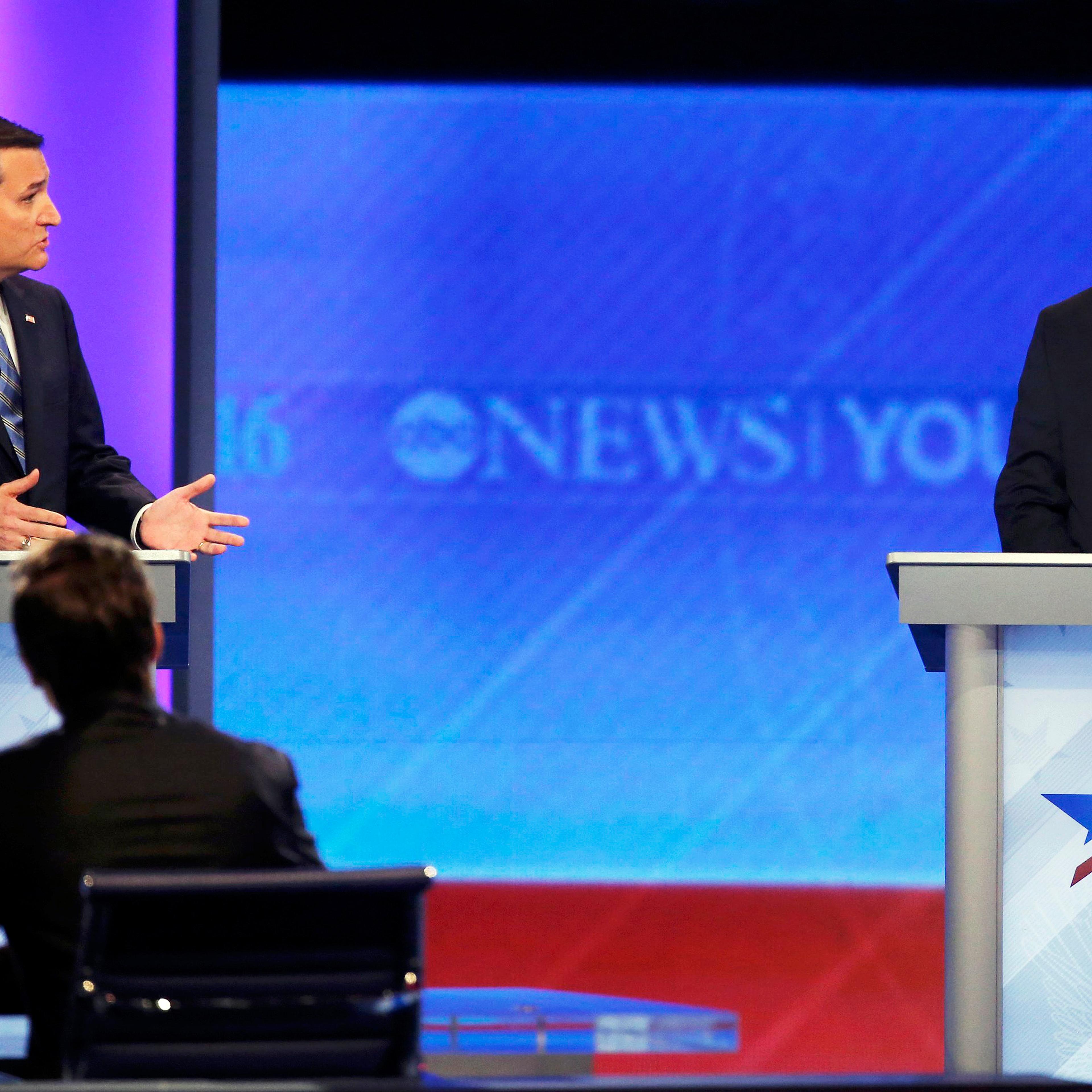 Republican presidential candidates Texas Sen. Ted Cruz and Dr. Ben Carson speak during debate during a Republican presidential debate on Feb. 6, 2016 at Saint Anselm College in Manchester, N.H.