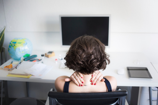 woman-massaging-neck-desk