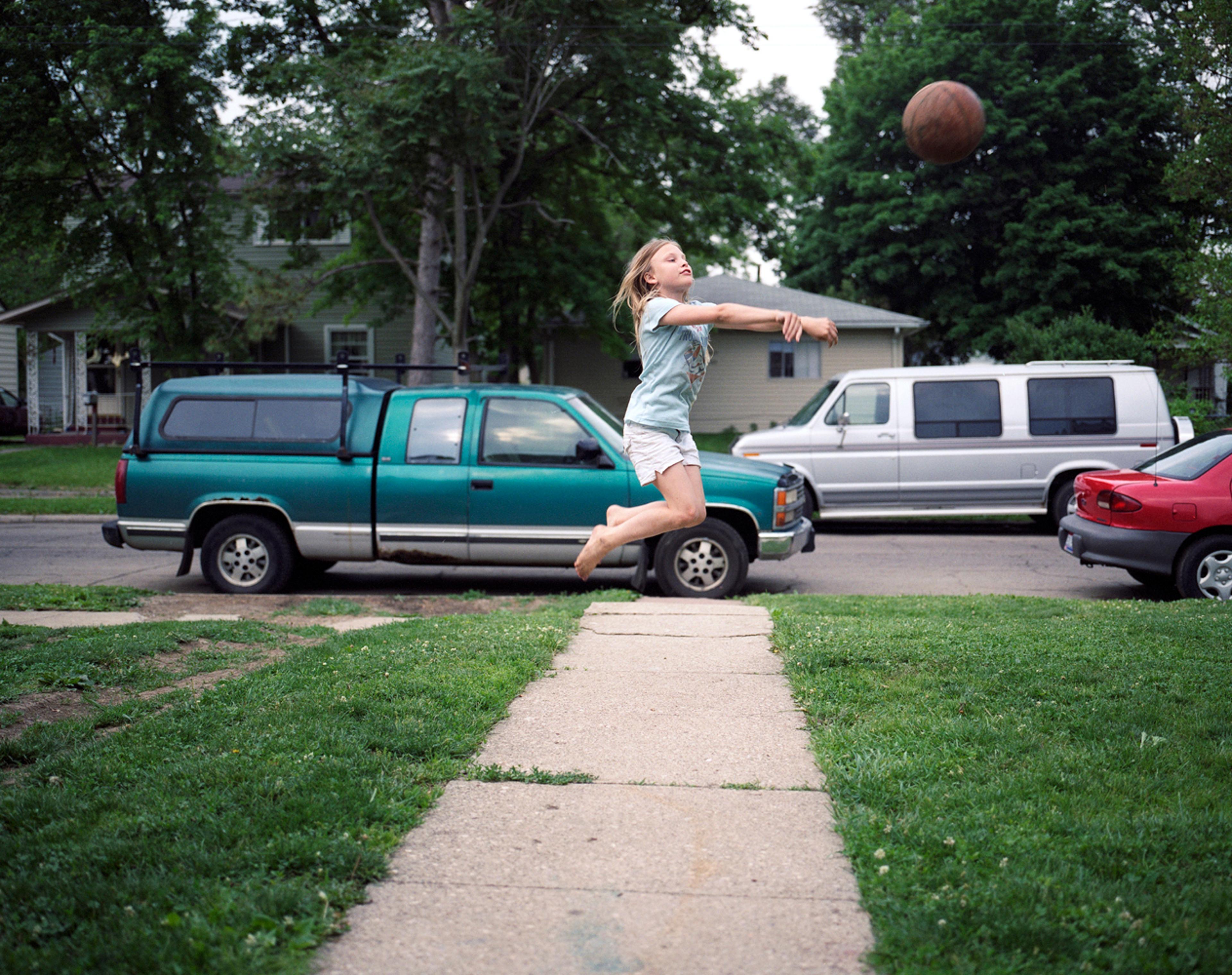 Playing basketball in the frontyard. 2009