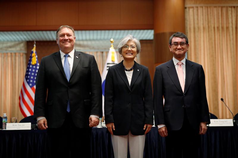 U.S. Secretary of State Mike Pompeo, South Korean Foreign Minister Kang Kyung-wha and Japan's Foreign Minister Taro Kono pose during a trilateral meeting at the Foreign Ministry in Seoul