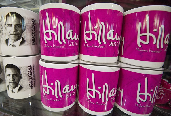 Coffee cups with US President Barack Obama and name of Democrat Presidential hopeful Hillary Clinton are seen for sale at a gift shop on June 8, 2015 at Ronald Reagan National Airport in Washington.