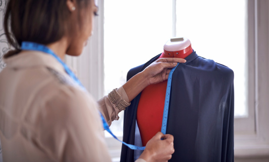 woman-using-tape-measure
