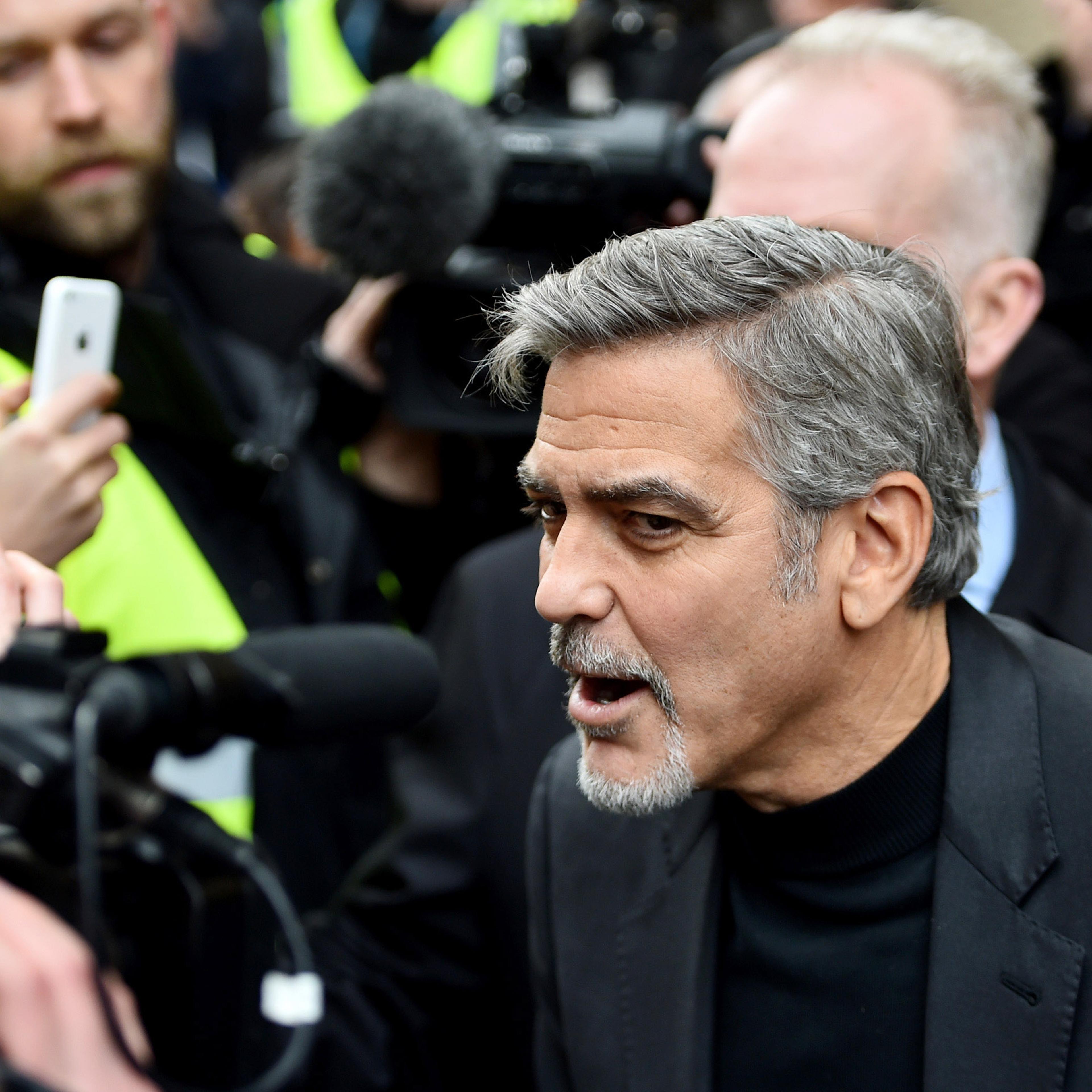 Hollywood actor George Clooney, meets members of the public during a visit to Social Bite sandwich shop which helps homeless people on November 12, 2015 in Edinburgh,Scotland.