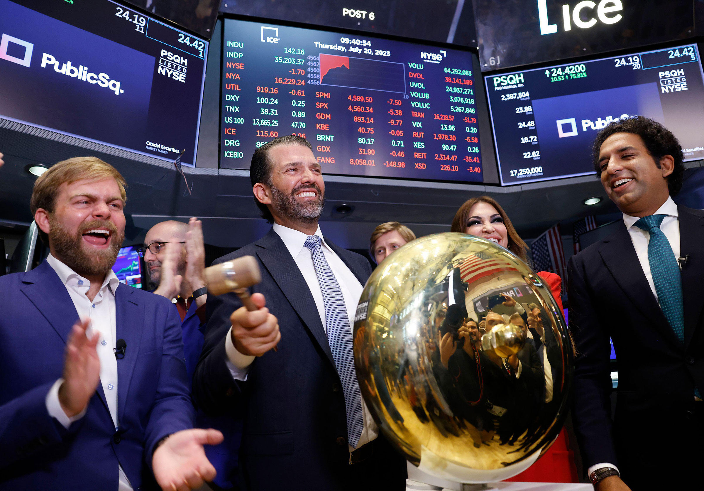 PublicSq. Founder and CEO Michael Seifert, left, Colombier Acquisition Corp. Chairman and CEO Omeed Malik, right, and Donald Trump Jr., center, and Kimberly Guilfoyle ring the ceremonial bell when trading begins for PublicSq. on the floor of the New York