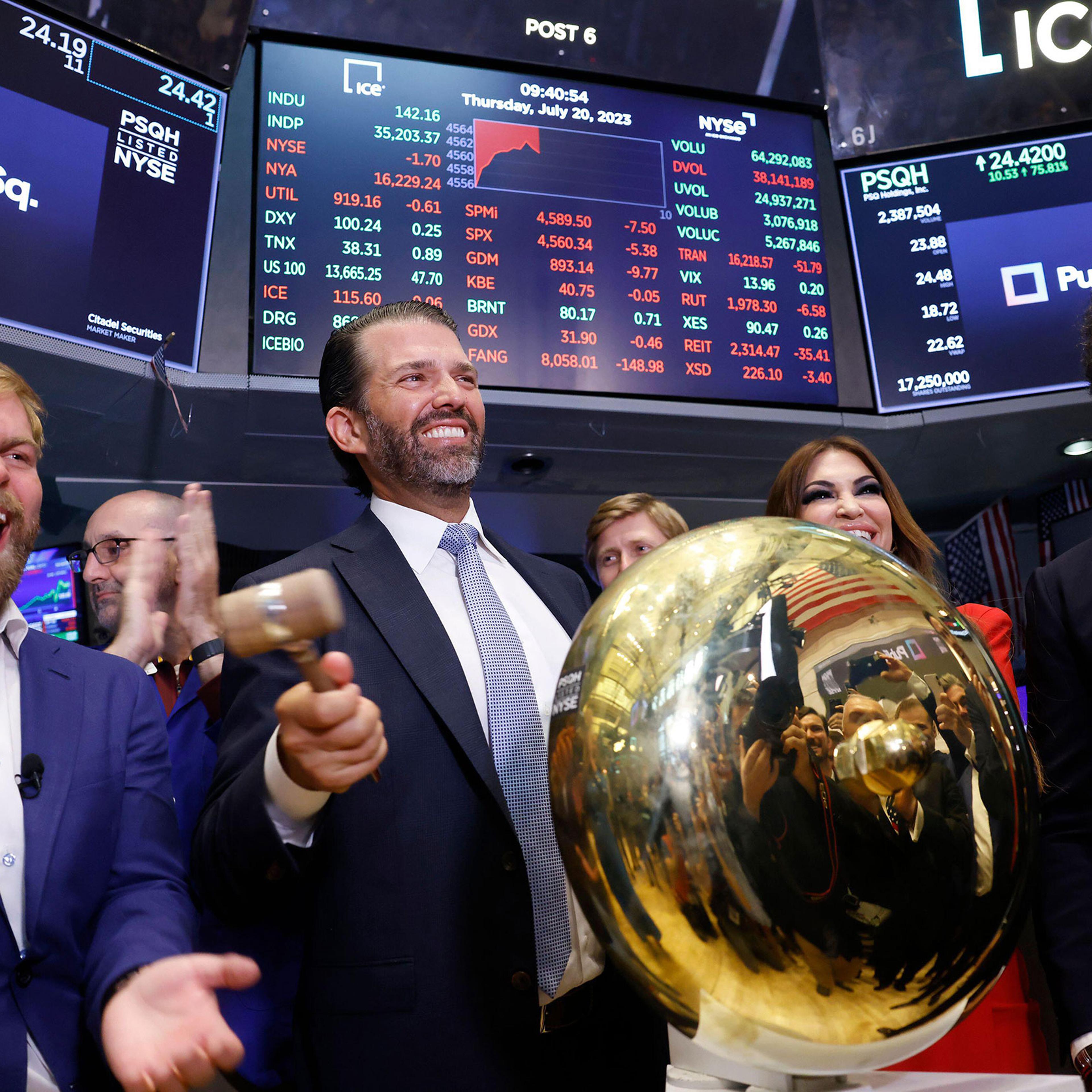 PublicSq. Founder and CEO Michael Seifert, left, Colombier Acquisition Corp. Chairman and CEO Omeed Malik, right, and Donald Trump Jr., center, and Kimberly Guilfoyle ring the ceremonial bell when trading begins for PublicSq. on the floor of the New York