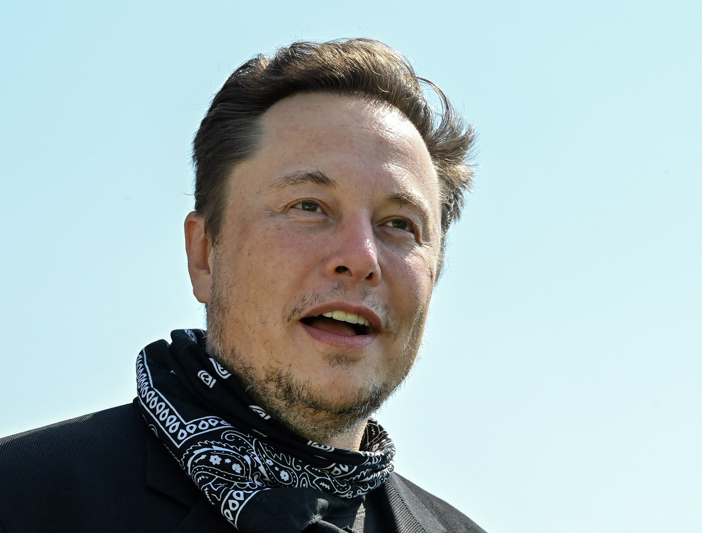 Elon Musk speaks to press outside the Tesla Gigafactory in Grünheide, Germany in August 2021.